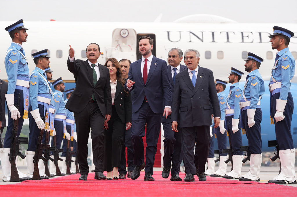 US Vice President JD Vance, centre, walks with Pakistan's Chief of Defence Forces and Chief of Army Staff Field Marshall Asim Munir, left, and Pakistani Deputy Prime Minister and Foreign Minister Mohammad Ishaq Dar 