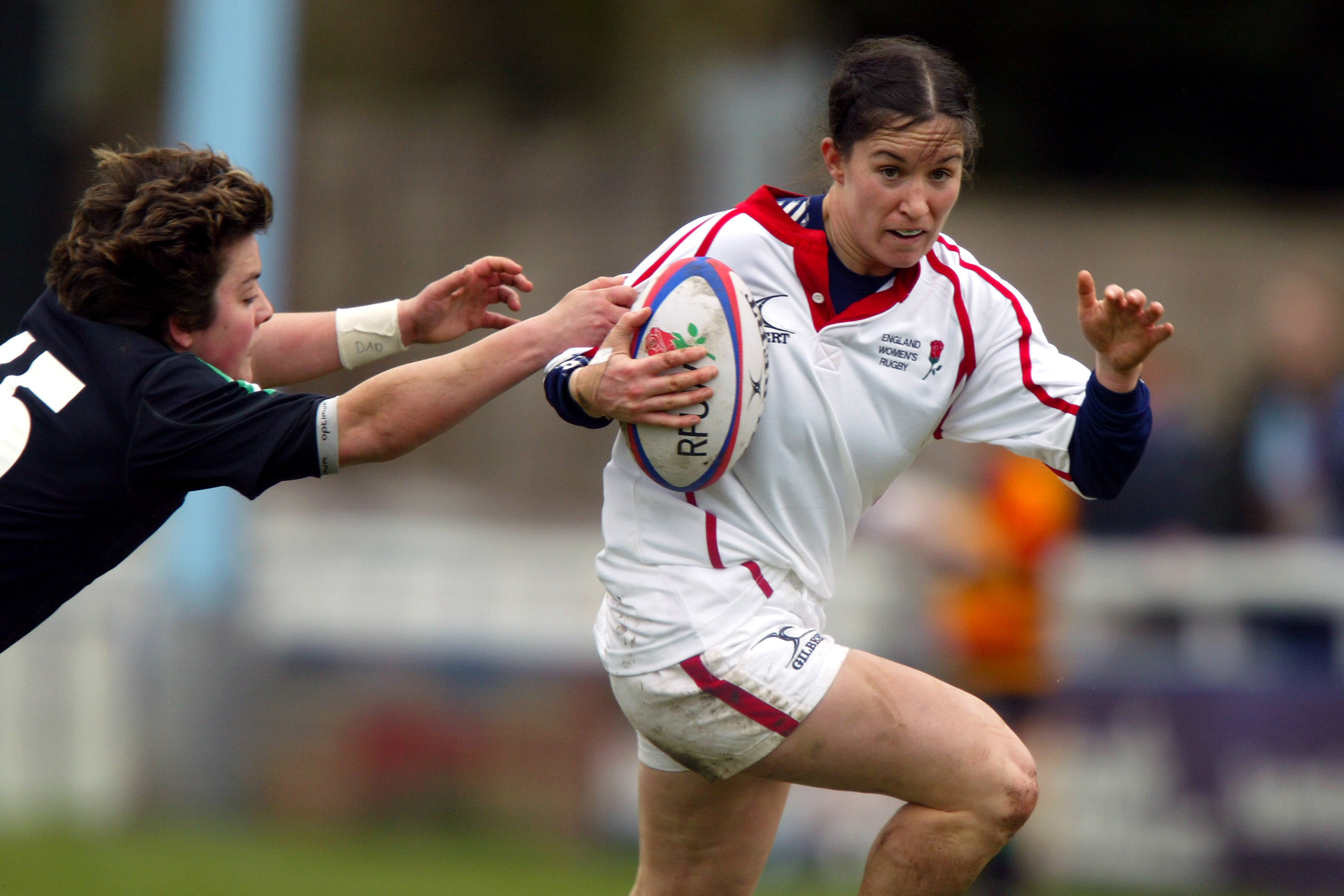 Joanne Yapp, England escapes a Welsh tackle.