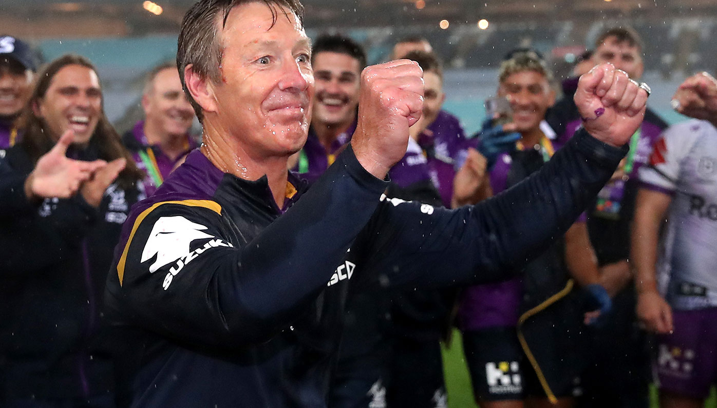 Craig Bellamy celebrates Melbourne's premiership win over Penrith.