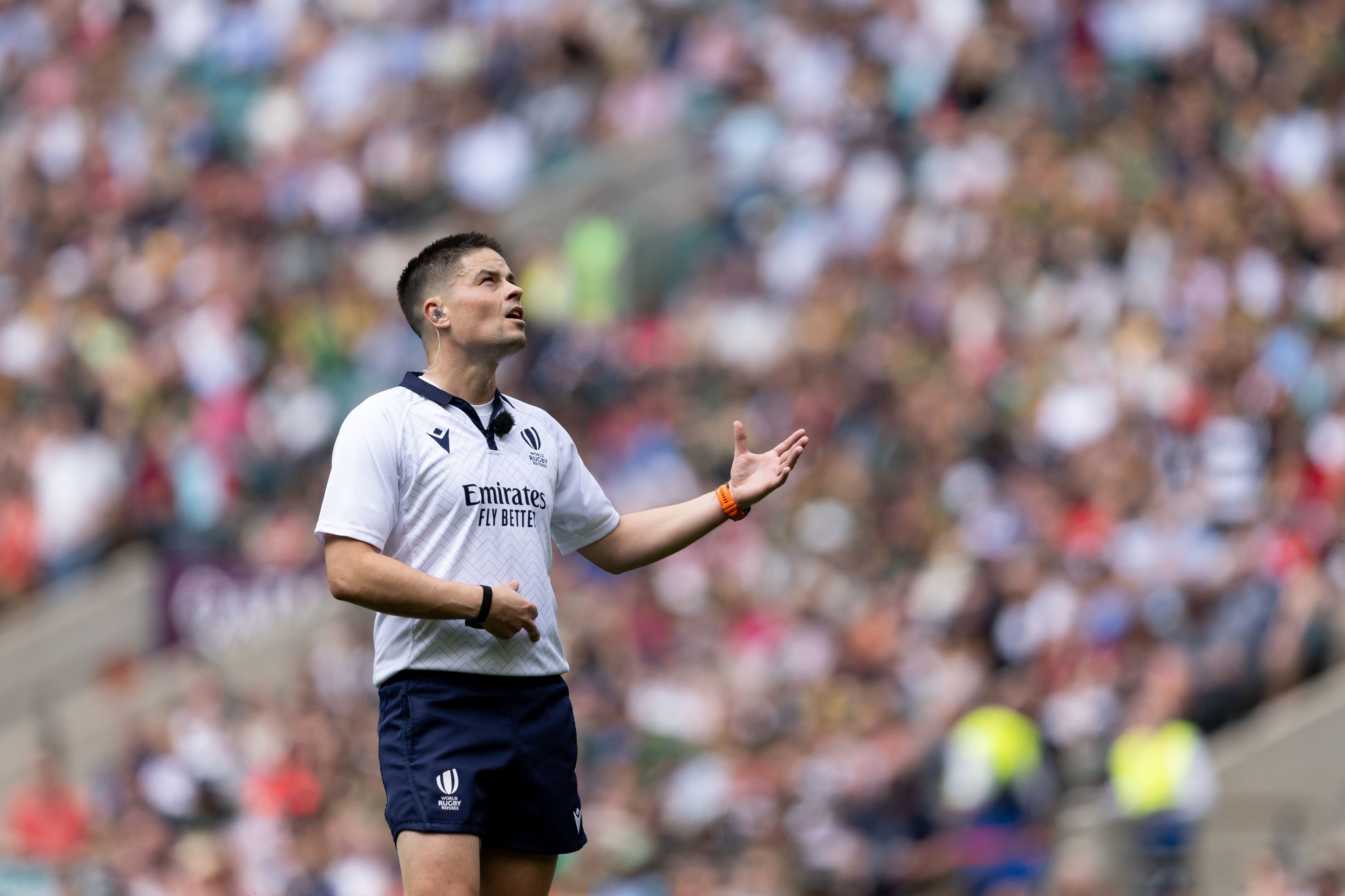 Referee Chris Busby checks an action with the TMO at Twickenham.