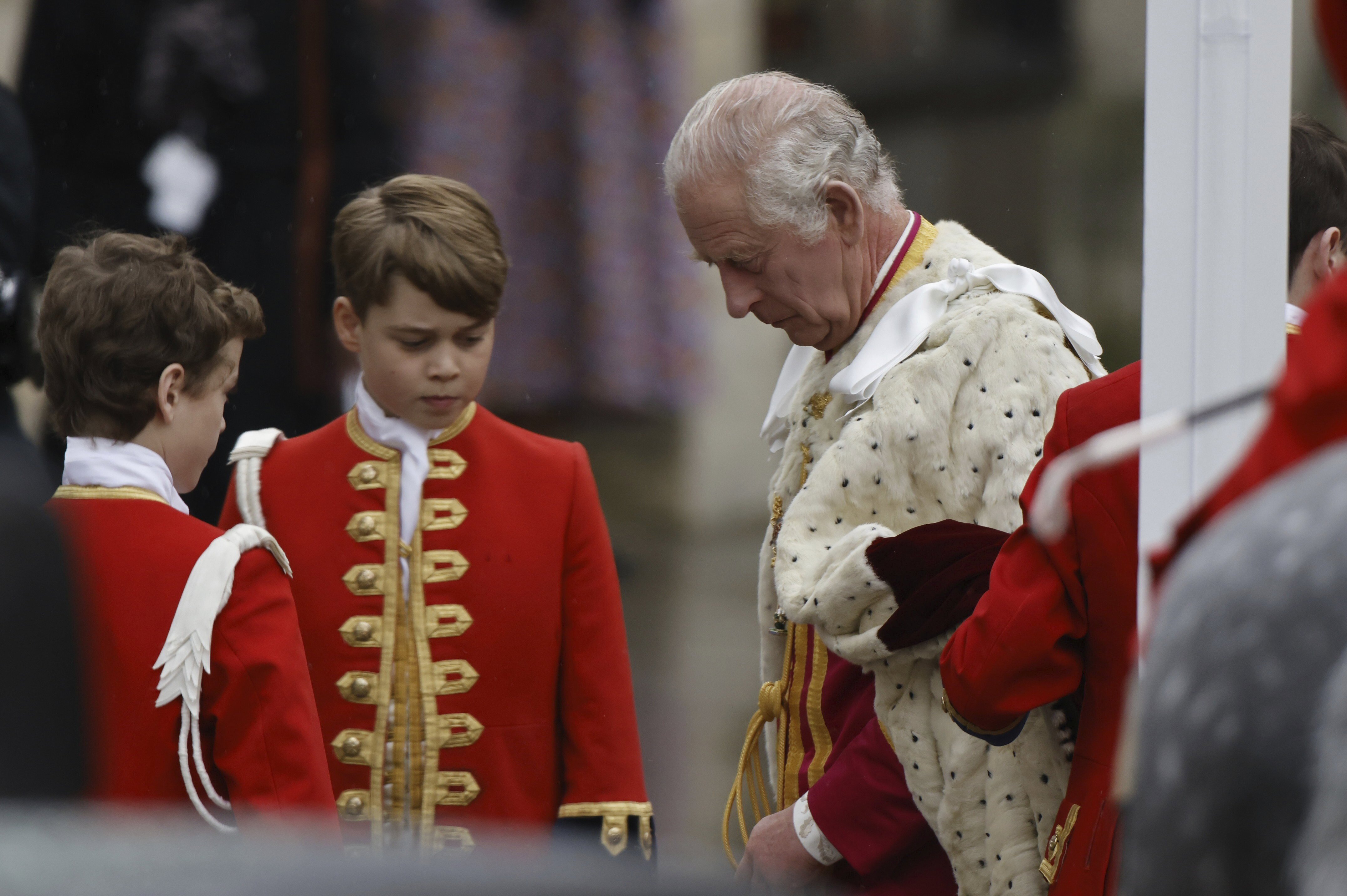 Britain's Prince George of Wales and King Charles III are seen before the coronation of King Charles III at Westminster Abbey in London, Saturday, May 6, 2023. (Jamie Lorriman/Pool Photo via AP)