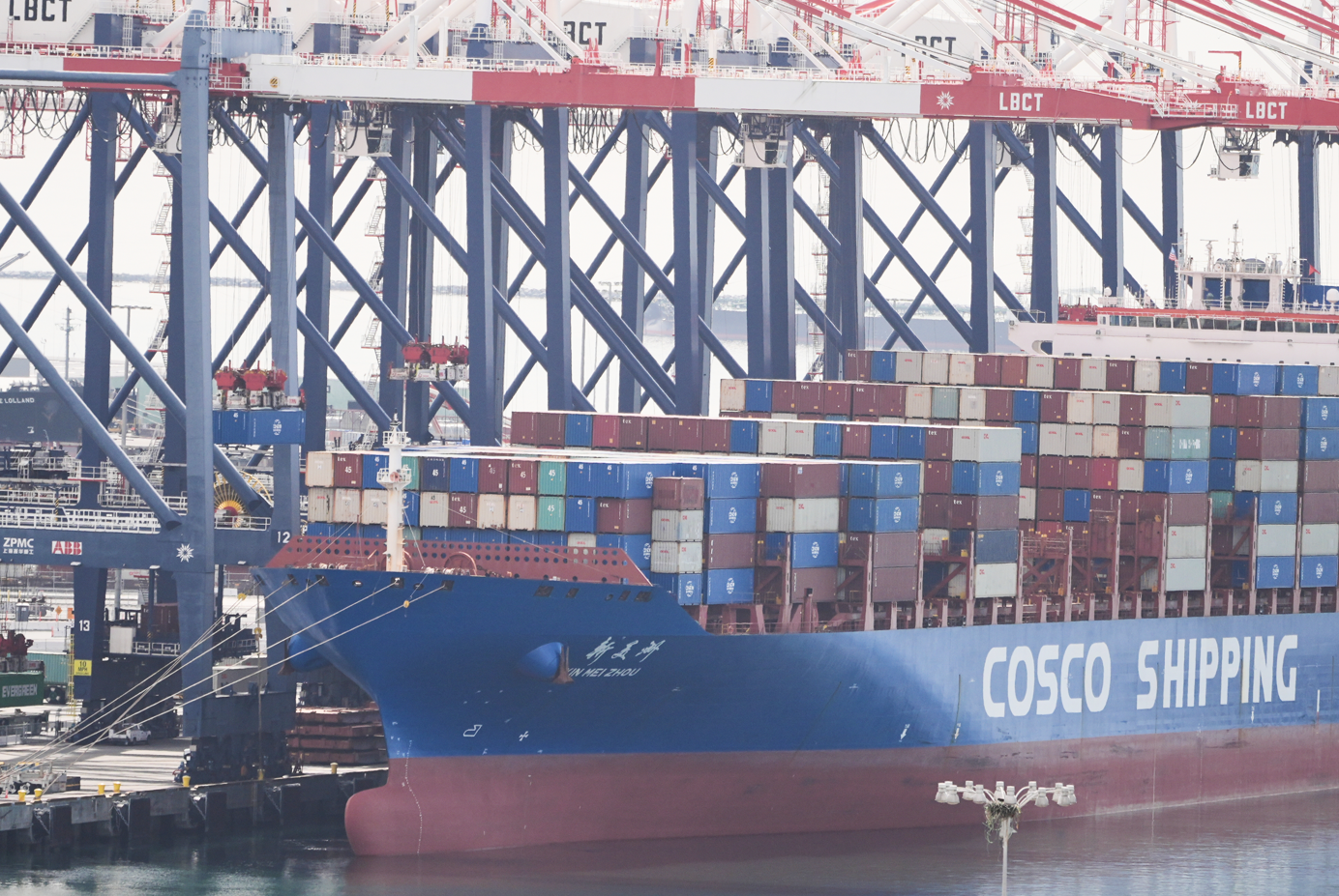 A ship is docked at the Port of Long Beach Friday, Feb. 20, 2026, in Long Beach, Calif. (AP Photo/Damian Dovarganes) 