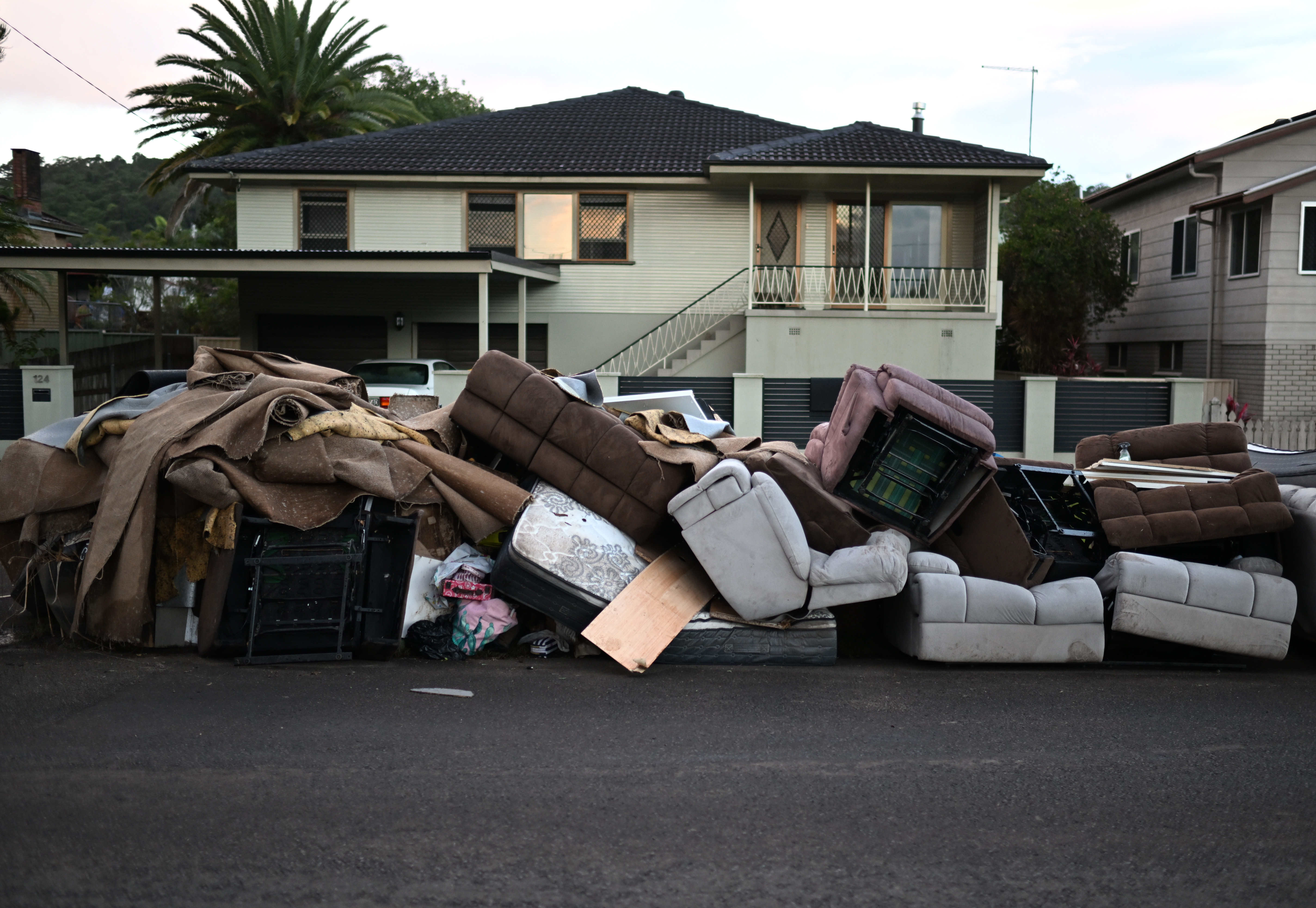 LISMORE, AUSTRALIA - MARCH 02:  Discarded furniture outside a flood affected property on March 02, 2022 in Lismore, Australia. Several northern New South Wales towns have been forced to evacuate as Australia faces unprecedented storms and the worst flooding in a decade. (Photo by Dan Peled/Getty Images)