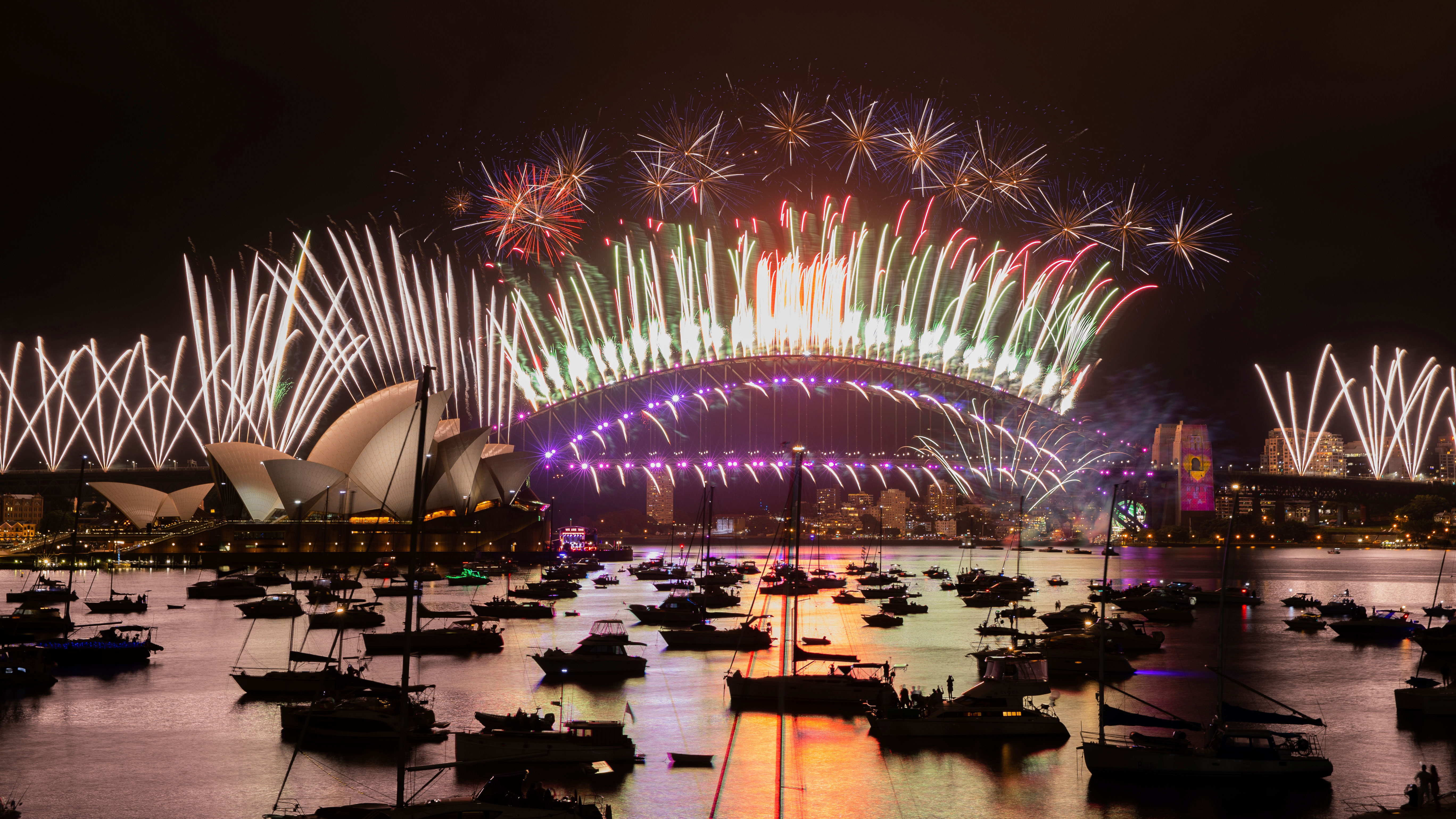 Melbourne, Canberra, Brisbane, and Adelaide all cancelled their official New Year's fireworks.Although the 9pm Sydney fireworks were also called off, the iconic show still went ahead at midnight. But there were no packed crowds lining Sydney's foreshores, which were closed off. New Year's Eve was instead a quiet, subdued affair in Sydney, with only some ticketed events going ahead in the CBD. At homes, only five visitors were allowed.