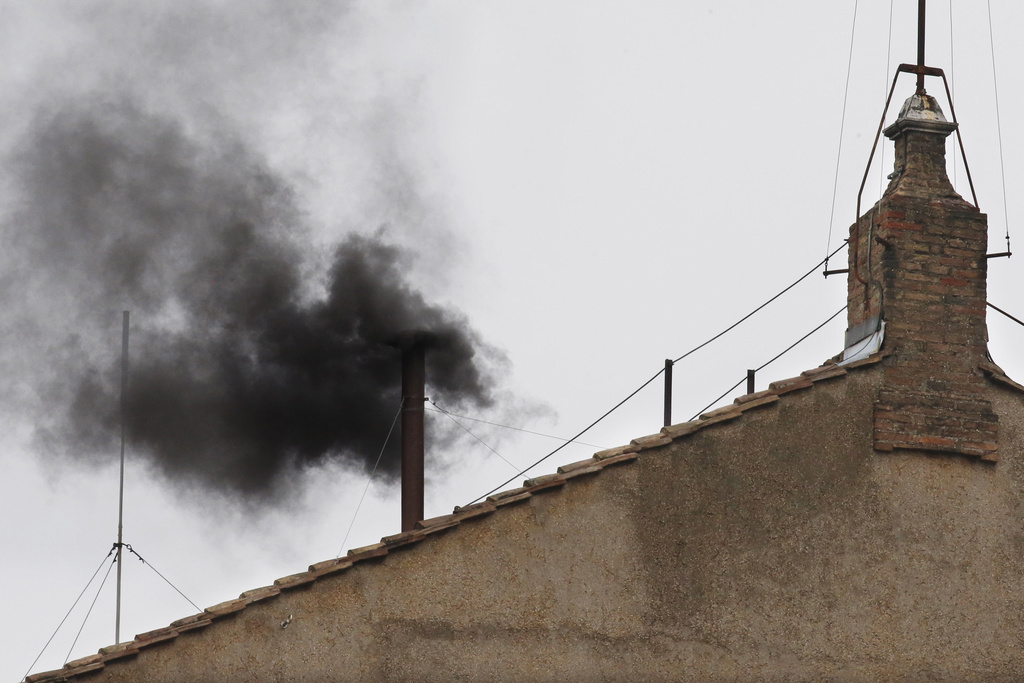 Black smoke emerges from the chimney on the Sistine Chapel as cardinals voted on the second day of the conclave to elect a pope in St. Peter's Square at the Vatican, back in 2013.