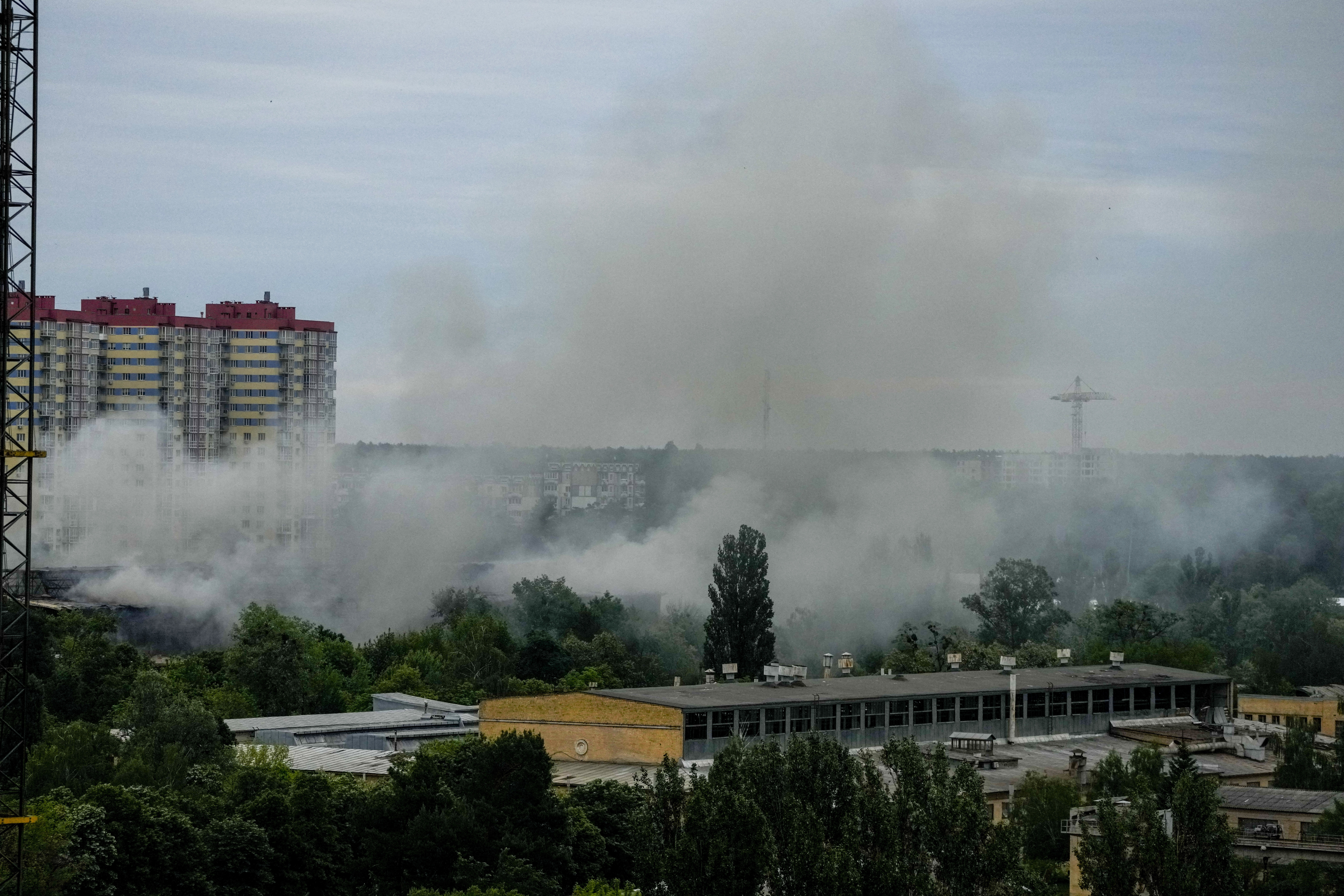 Smoke rises after a Russian missile strike in Kyiv, Ukraine, Sunday, June 5, 2022. (AP Photo/Natacha Pisarenko)
