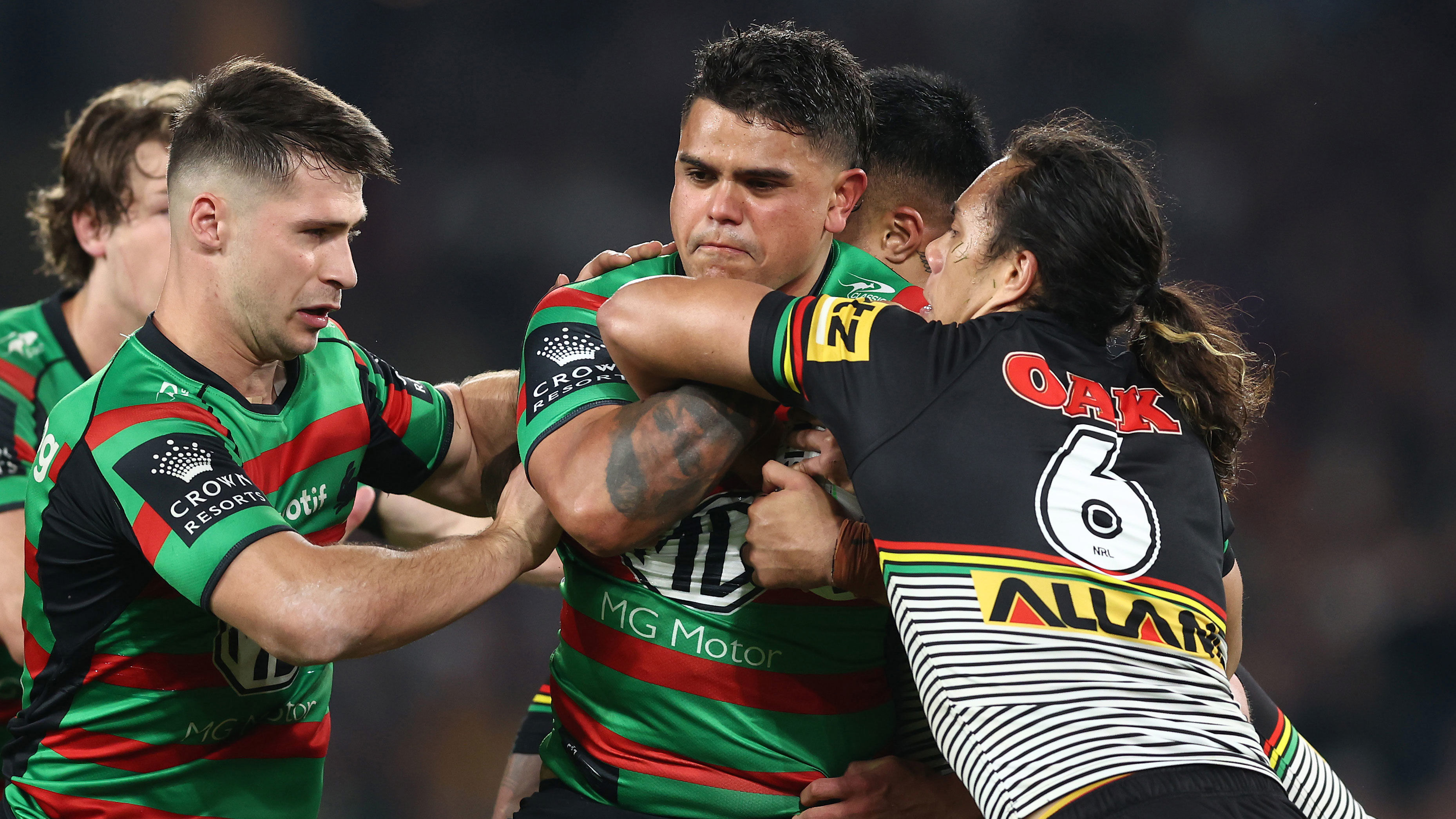 Latrell Mitchell attempts to bust through a Jarome Luai tackle in the 2022 preliminary final between Souths and Penrith.