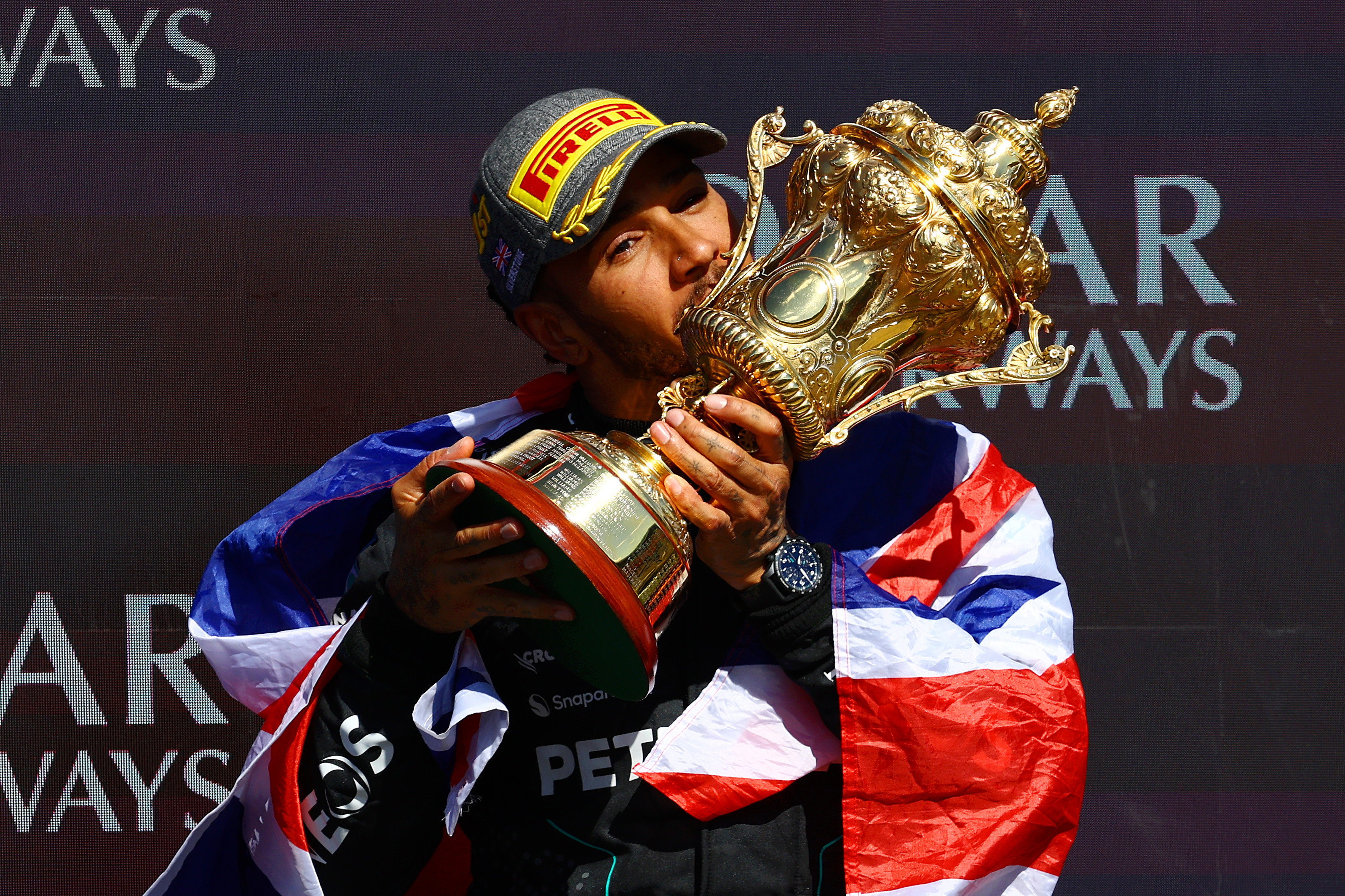 Race winner Lewis Hamilton of Great Britain and Mercedes celebrates on the podium during the F1 Grand Prix of Great Britain at Silverstone Circuit.