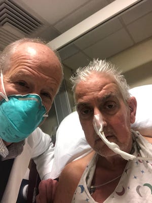 Dave Bennett (right) received a pig heart in a world first. Here he is pictured with lead surgeon Bartley Griffin.