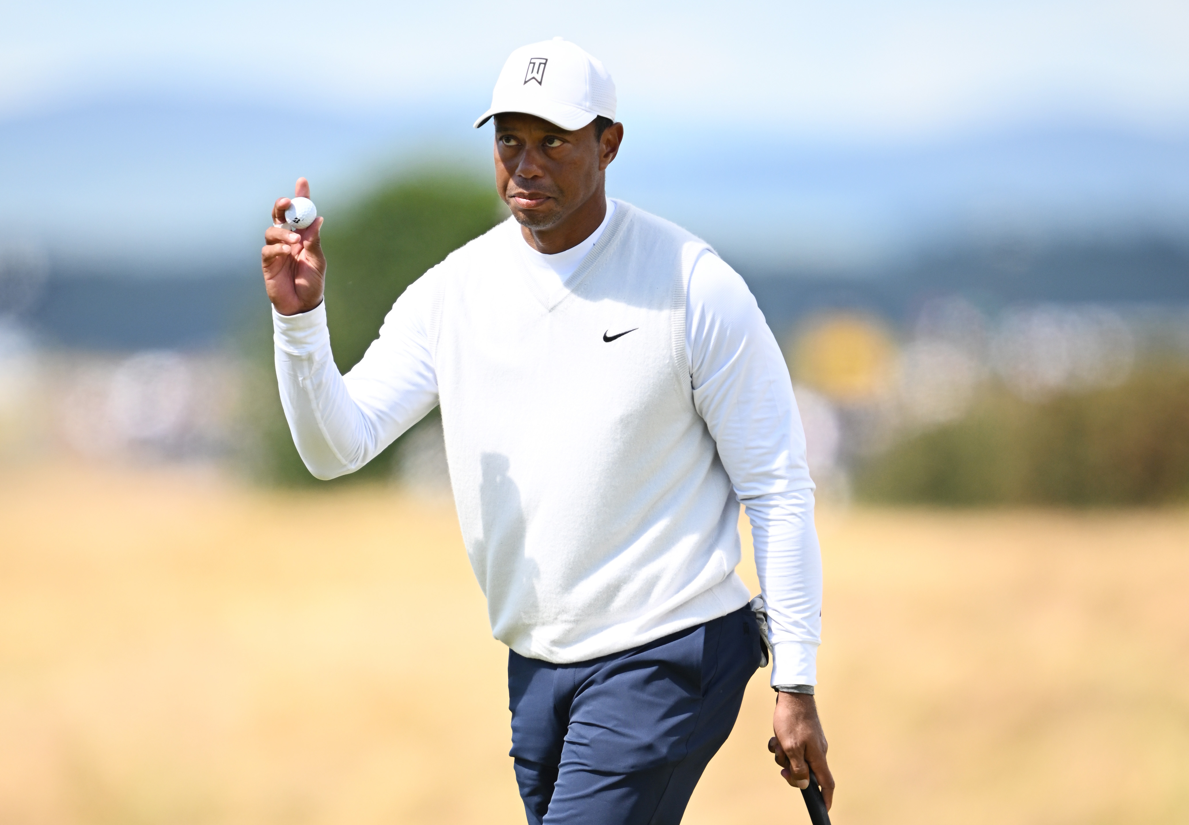 Tiger Woods of the United States acknowledges the crowd on the 17th green during Day Two of The 150th Open at St Andrews Old Course on July 15, 2022 in St Andrews, Scotland. (Photo by Stuart Franklin/R&A/R&A via Getty Images)