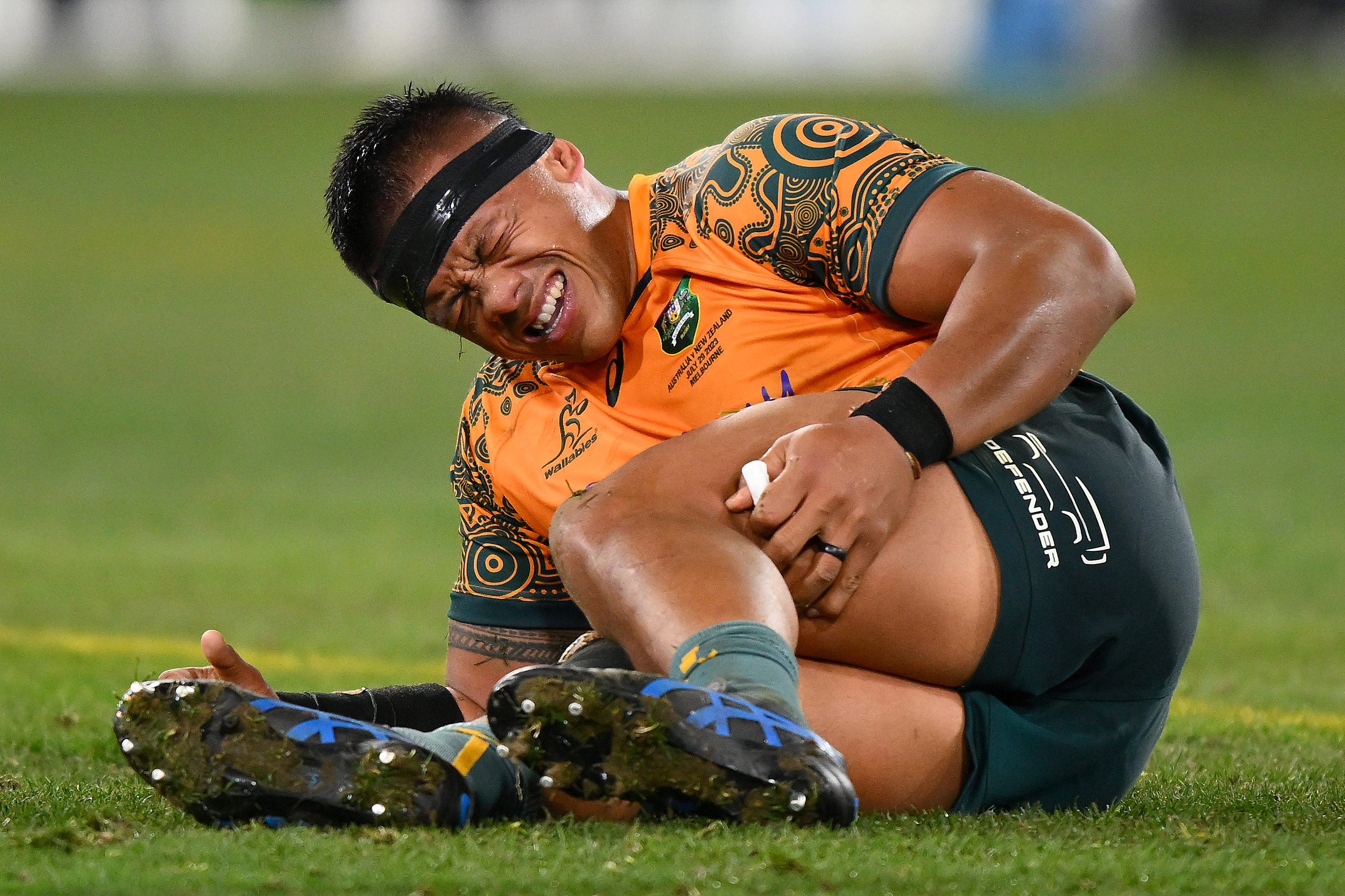 Allan Alaalatoa of the Wallabies reacts to his injury.