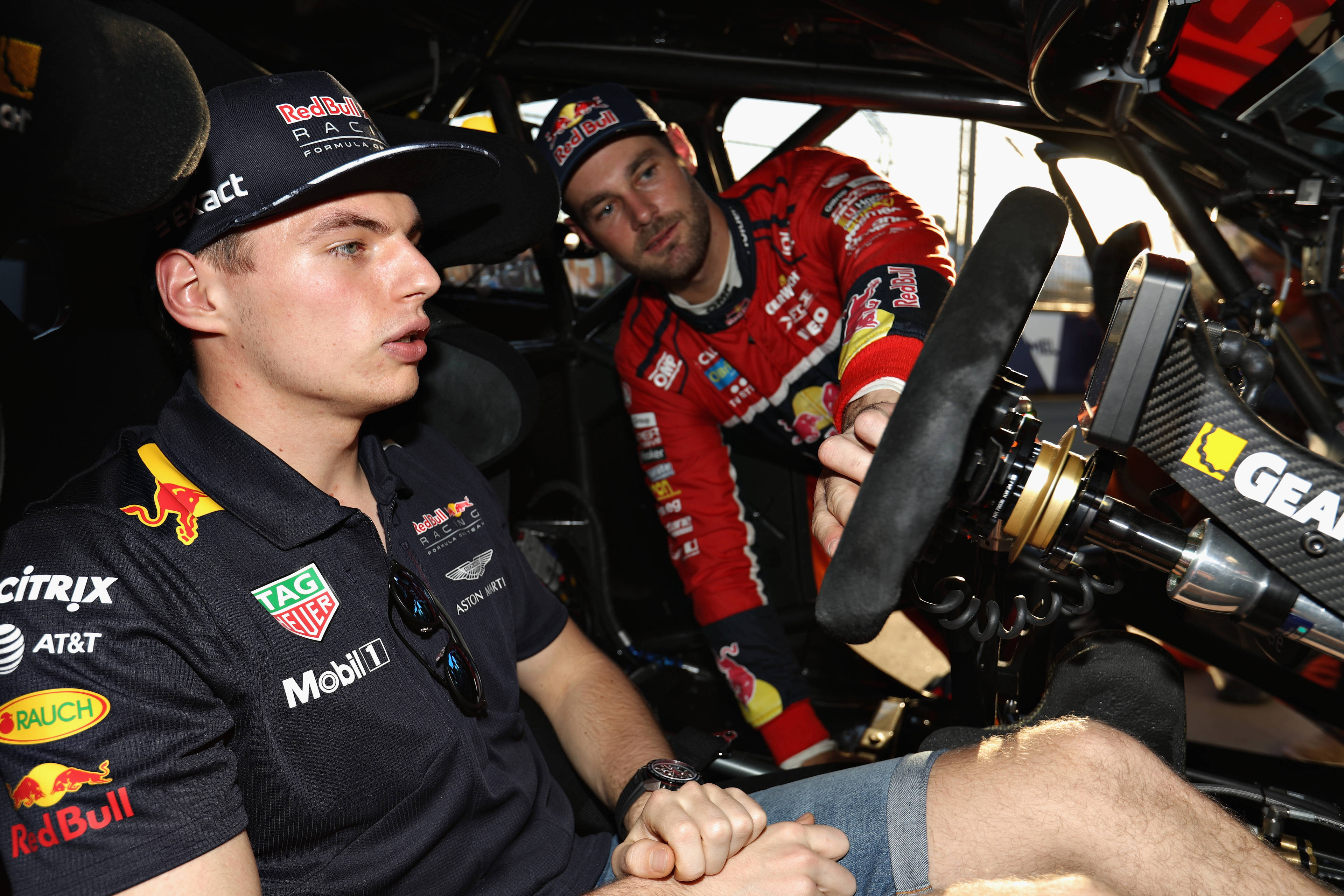 Max Verstappen (left) Racing talks with Supercar driver Shane Van Gisbergen during the 2017 Formula 1 Australian Grand Prix.