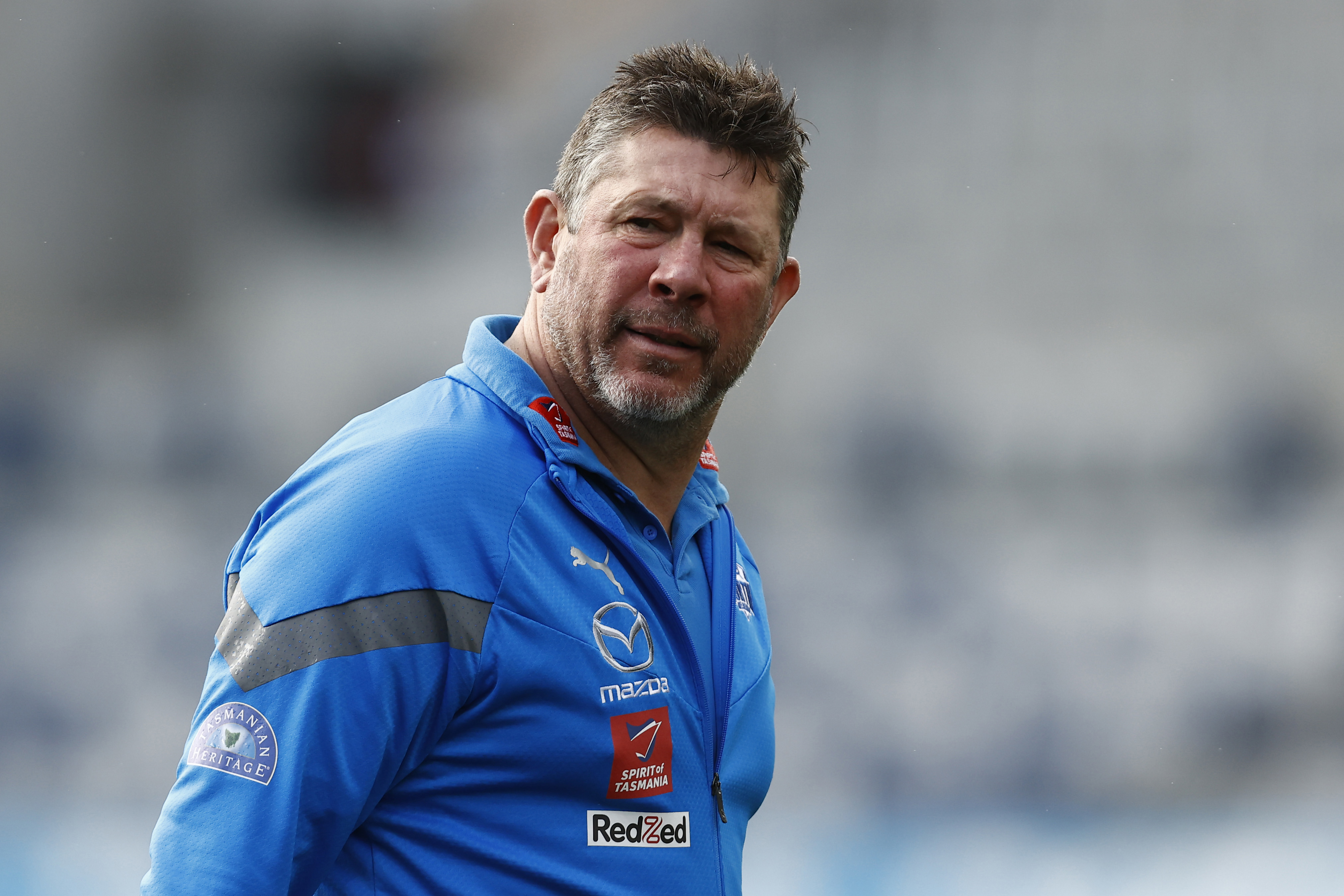 GEELONG, AUSTRALIA - JULY 09: Brett Ratten, North Melbourne caretaker coach looks on during the round 17 AFL match between Geelong Cats and North Melbourne Kangaroos at GMHBA Stadium, on July 09, 2023, in Geelong, Australia. (Photo by Darrian Traynor/Getty Images)