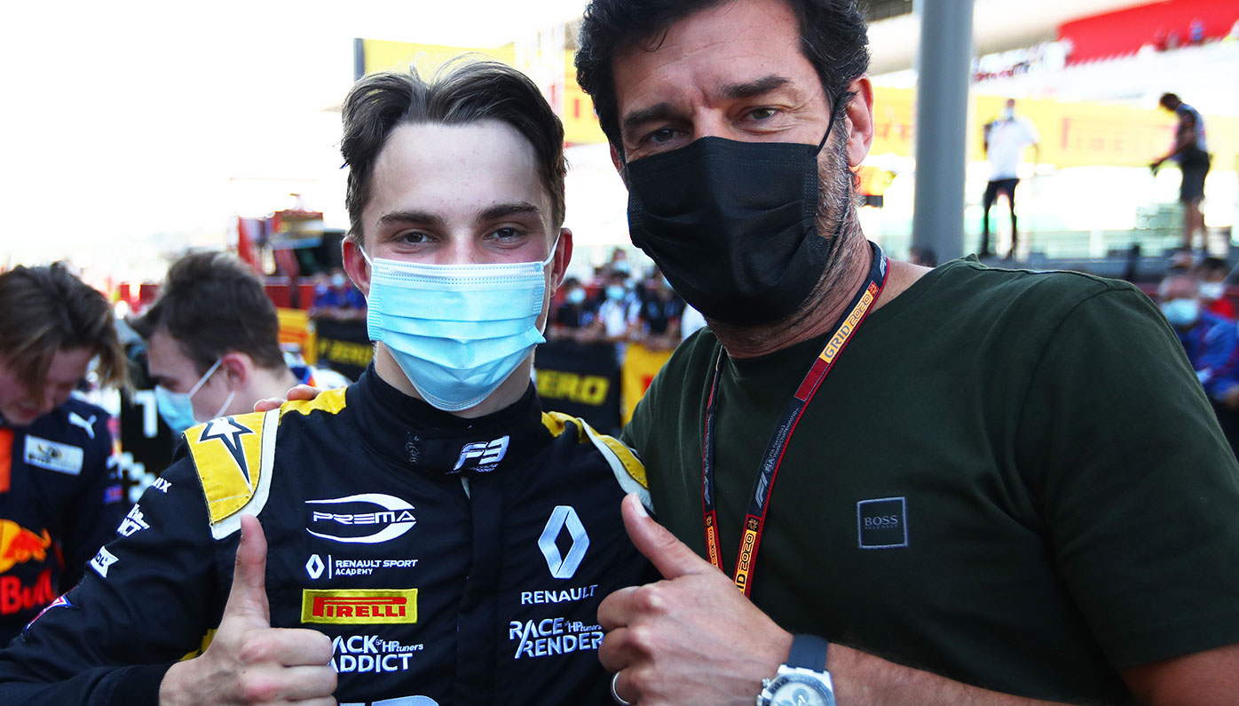 Oscar Piastri with Mark Webber moments after the Melbourne teenager clinched the F3 championship.