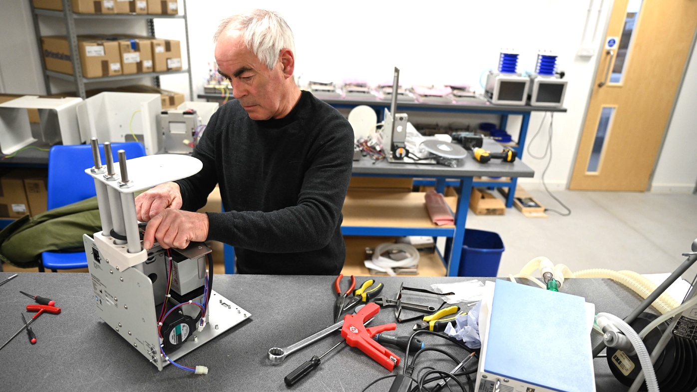 A man constructs a medical ventilator at the OES medical supply company in Witney, Britain. OES builds and supplies medical ventilators globally. They are altering their designs to make it more efficient and user-friendly to use in treating coronavirus.