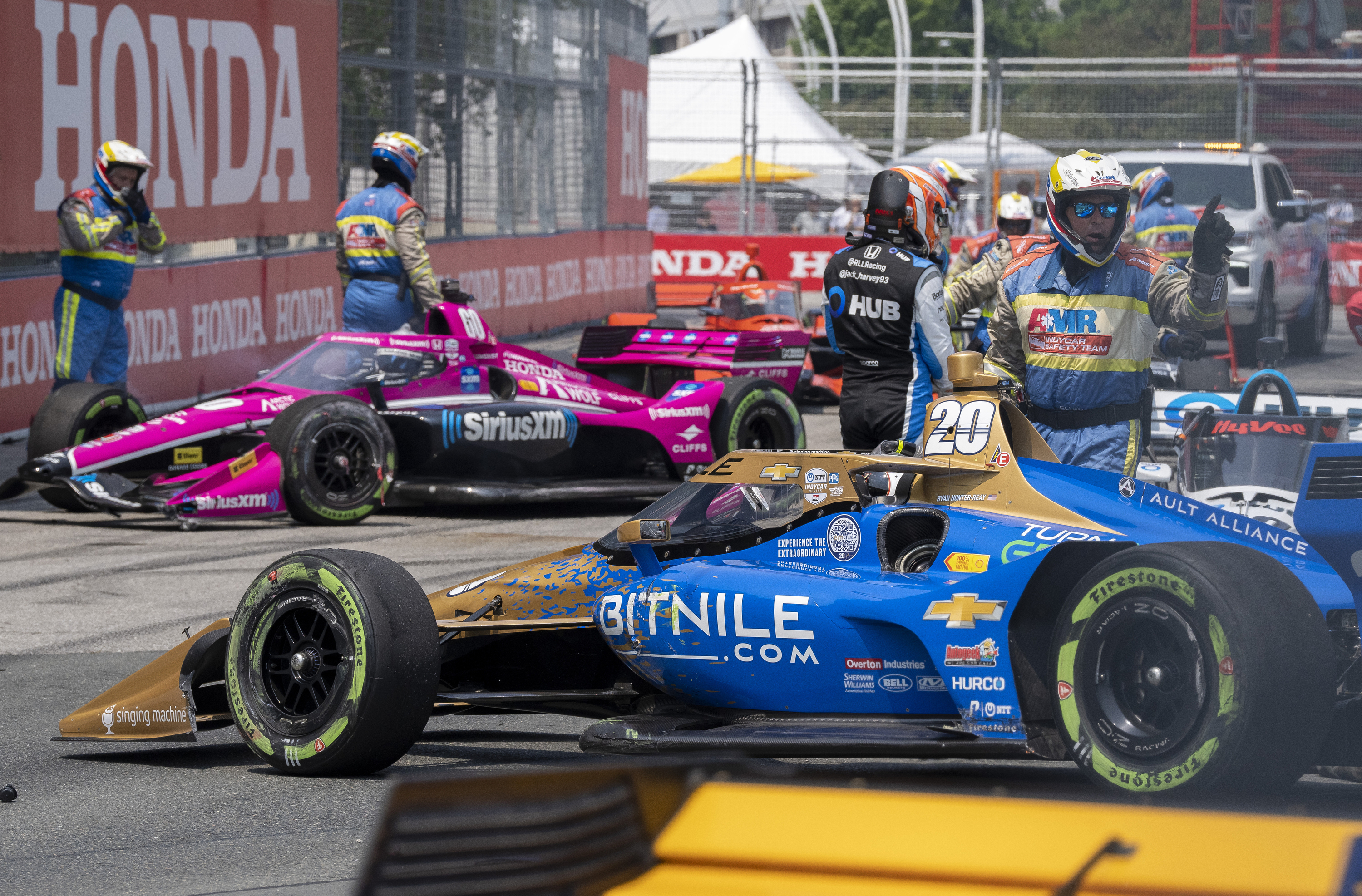 Tom Blomqvist's car (left) as the turn one tangle is cleaned up.