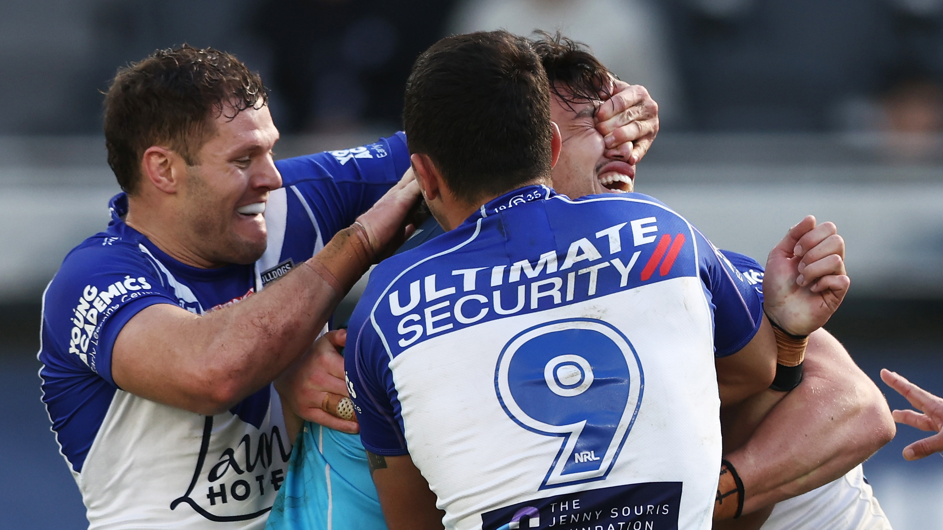 Corey Waddell of the Bulldogs tackles Tino Fa'asuamaleaui of the Titans with his hands on his eyes during the round 19 NRL match between the Canterbury Bulldogs and the Gold Coast Titans at CommBank Stadium, on July 24, 2022, in Sydney, Australia. (Photo by Matt King/Getty Images)