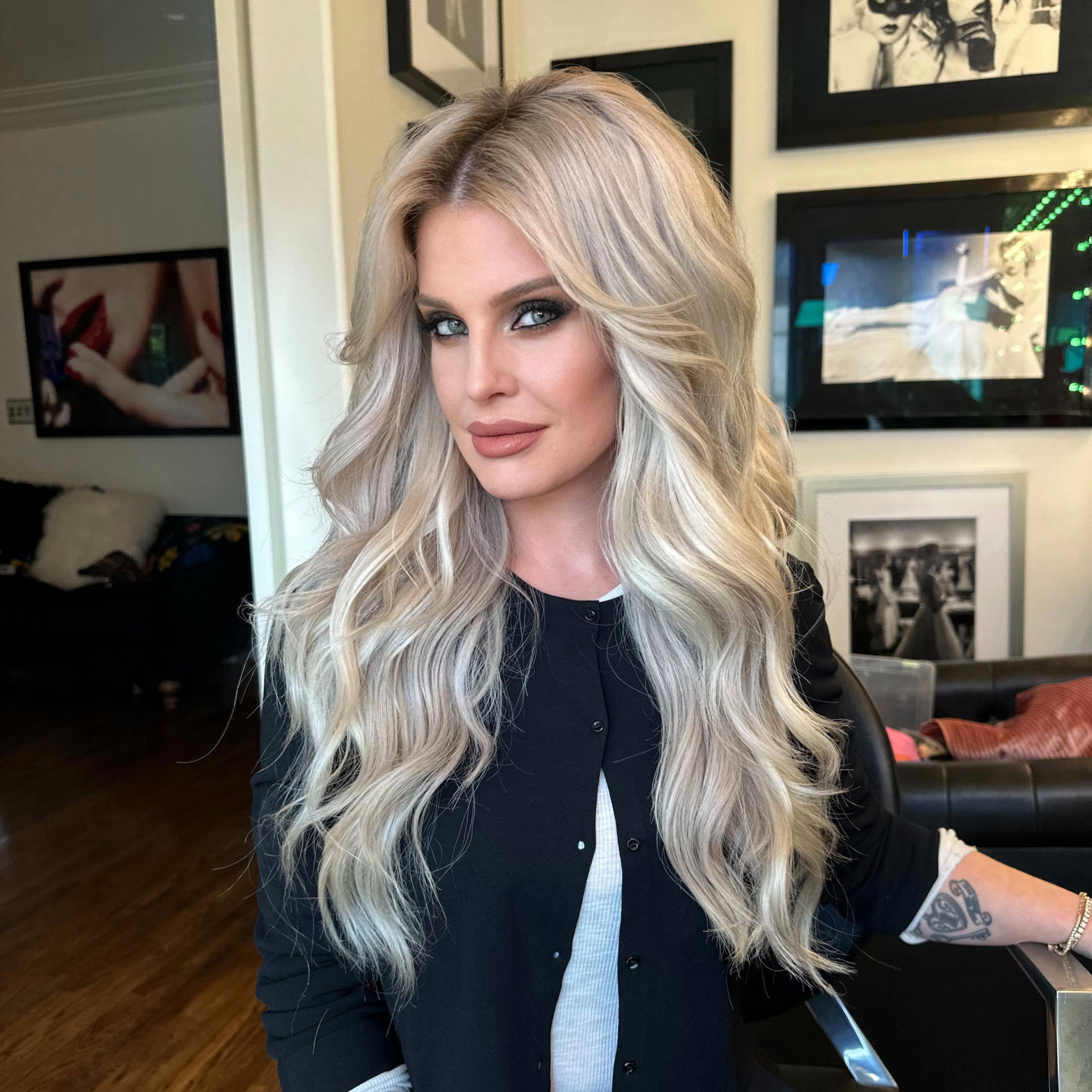 Kelly Osbourne poses with bright blonde hair after a transformation.