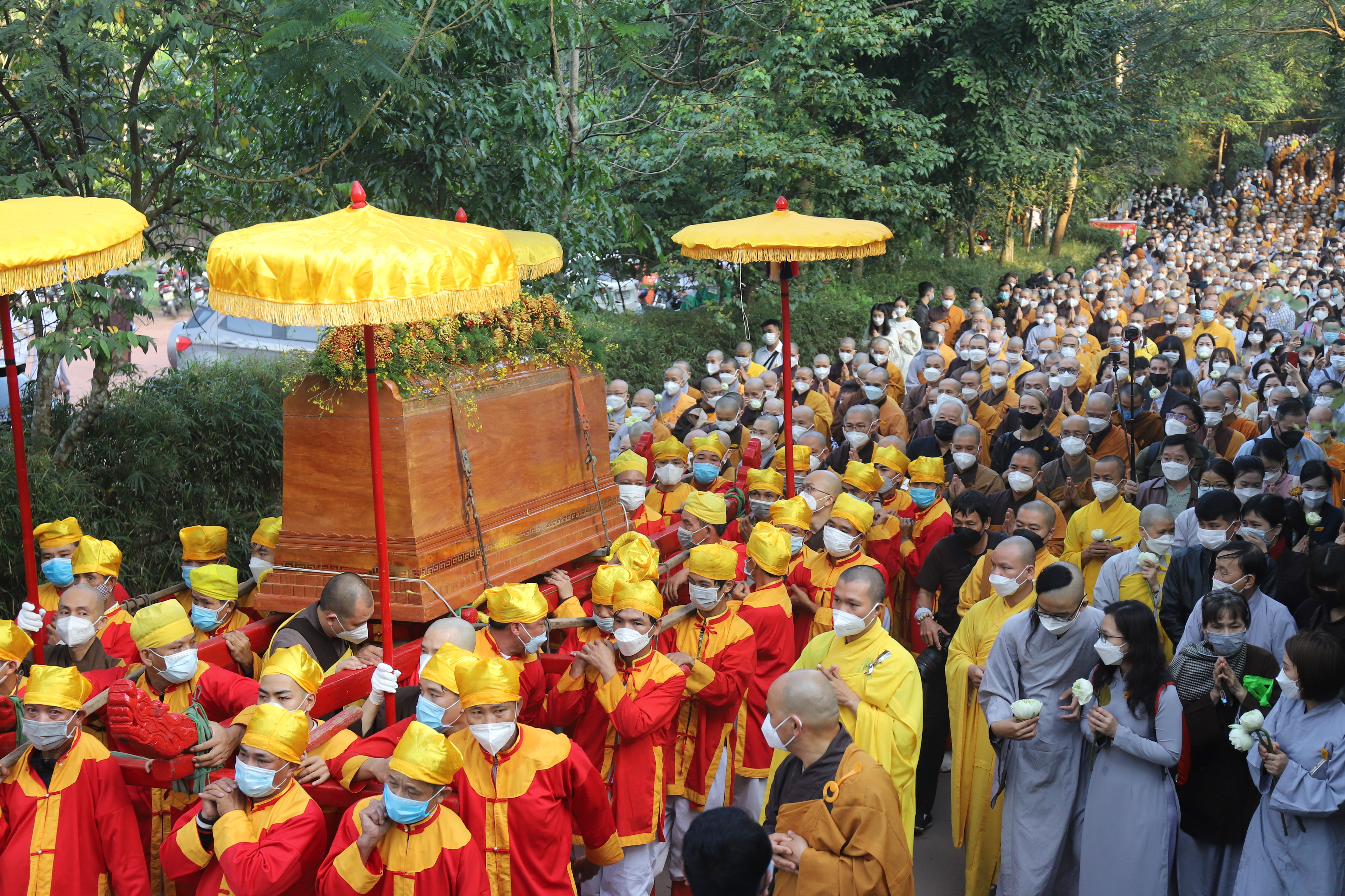 Coffin of Vietnamese renowned monk Thich Nhat Hanh is carried to the street during his funeral.