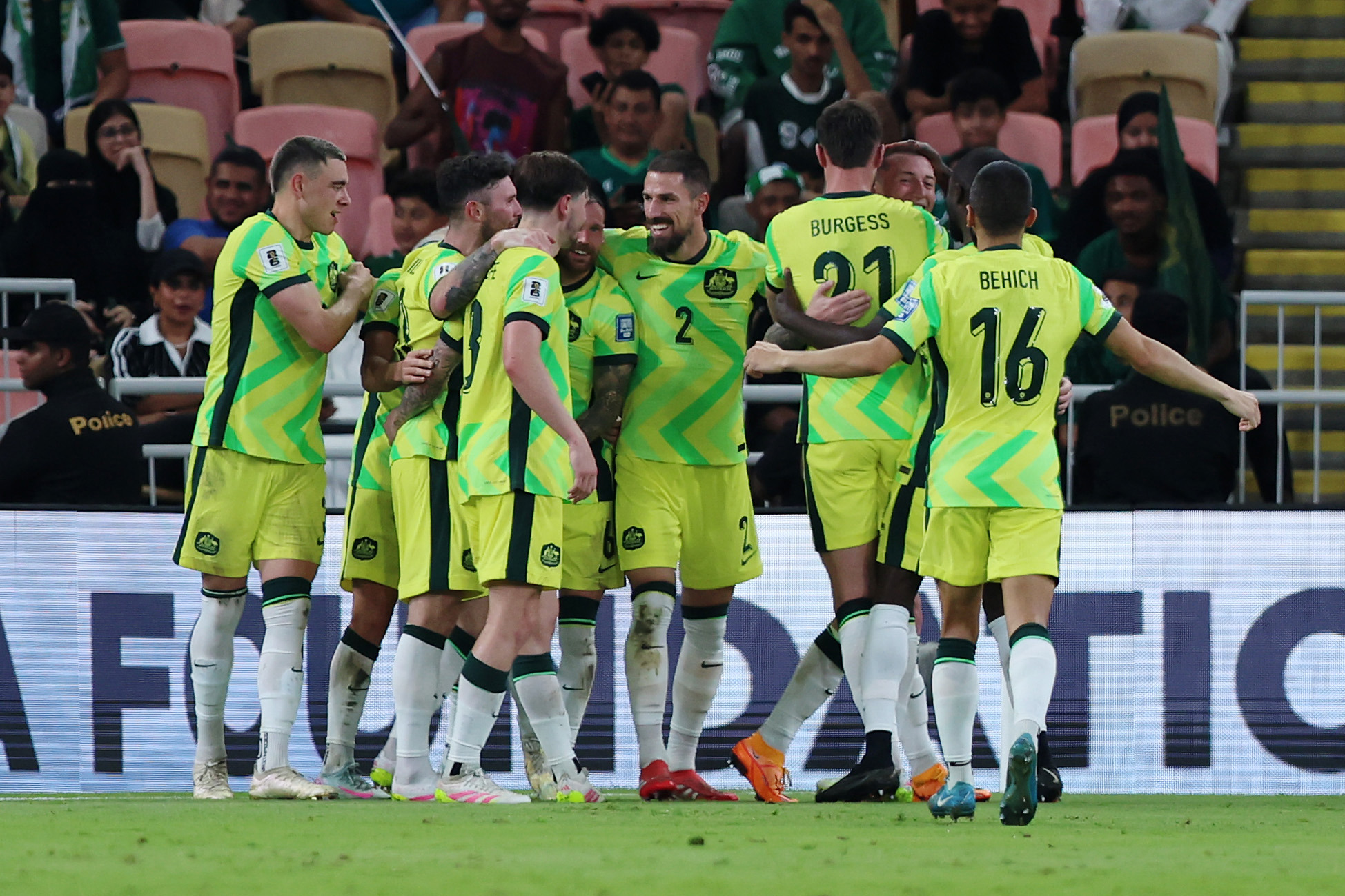 The Socceroos celebrate a Mitch Duke goal against Saudi Arabia.