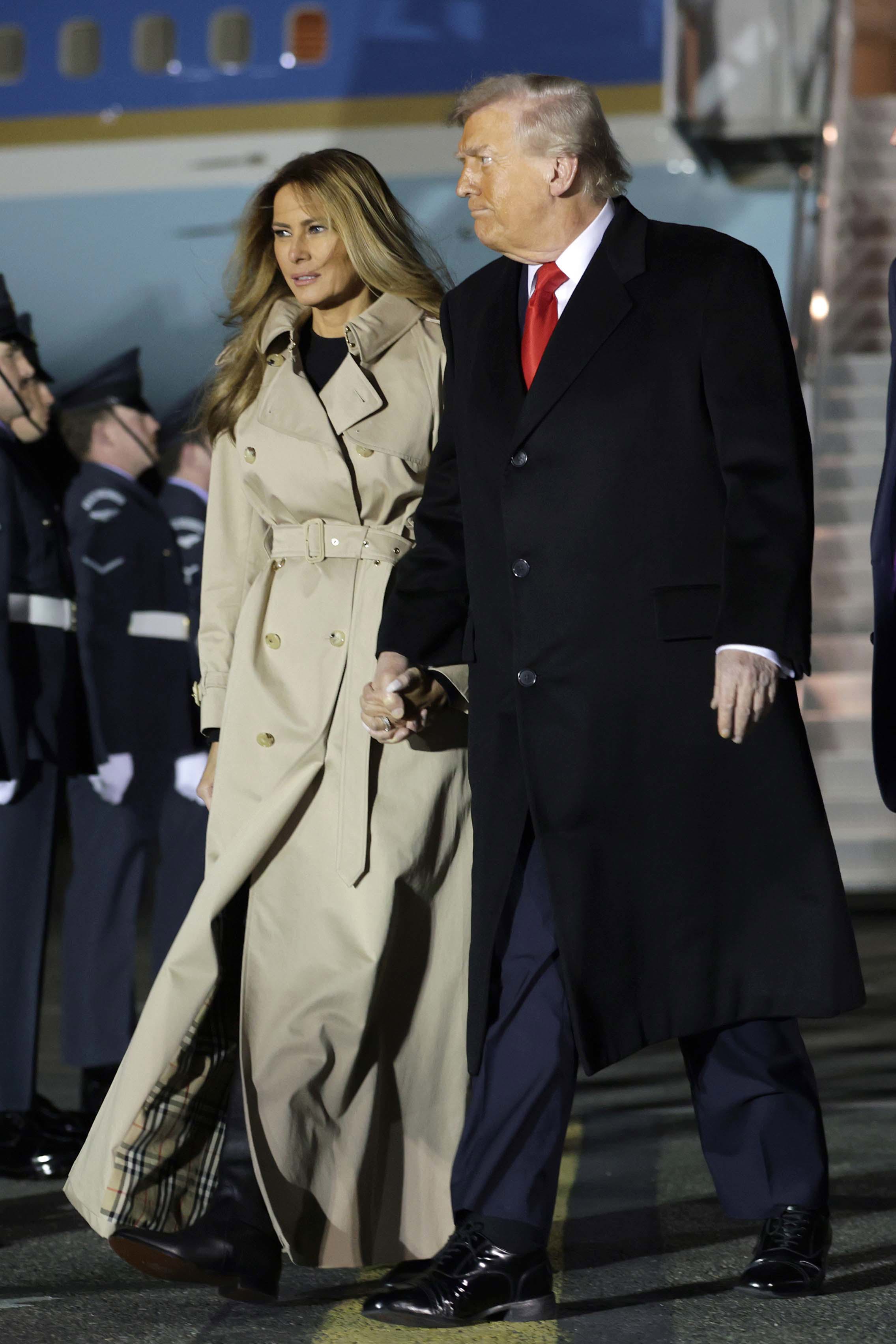 US President Donald Trump and First Lady Melania Trump exit Air Force One after arriving at London Stansted Airport.