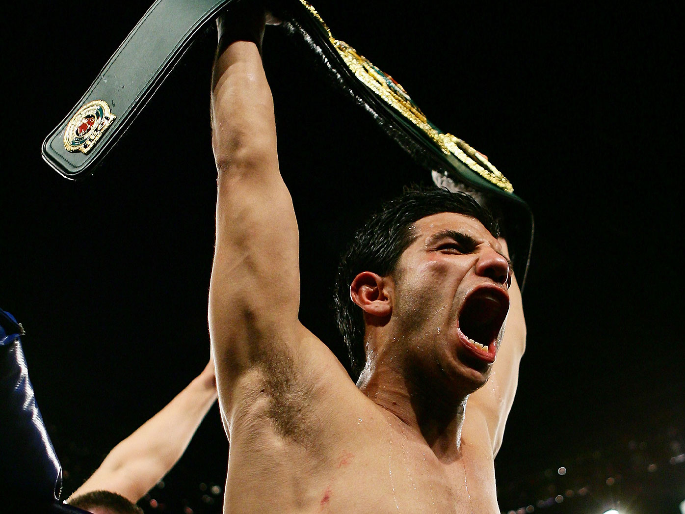 Billy Dib celebrates winning the IBO World Middleweight title over Zolani Marali in 2008