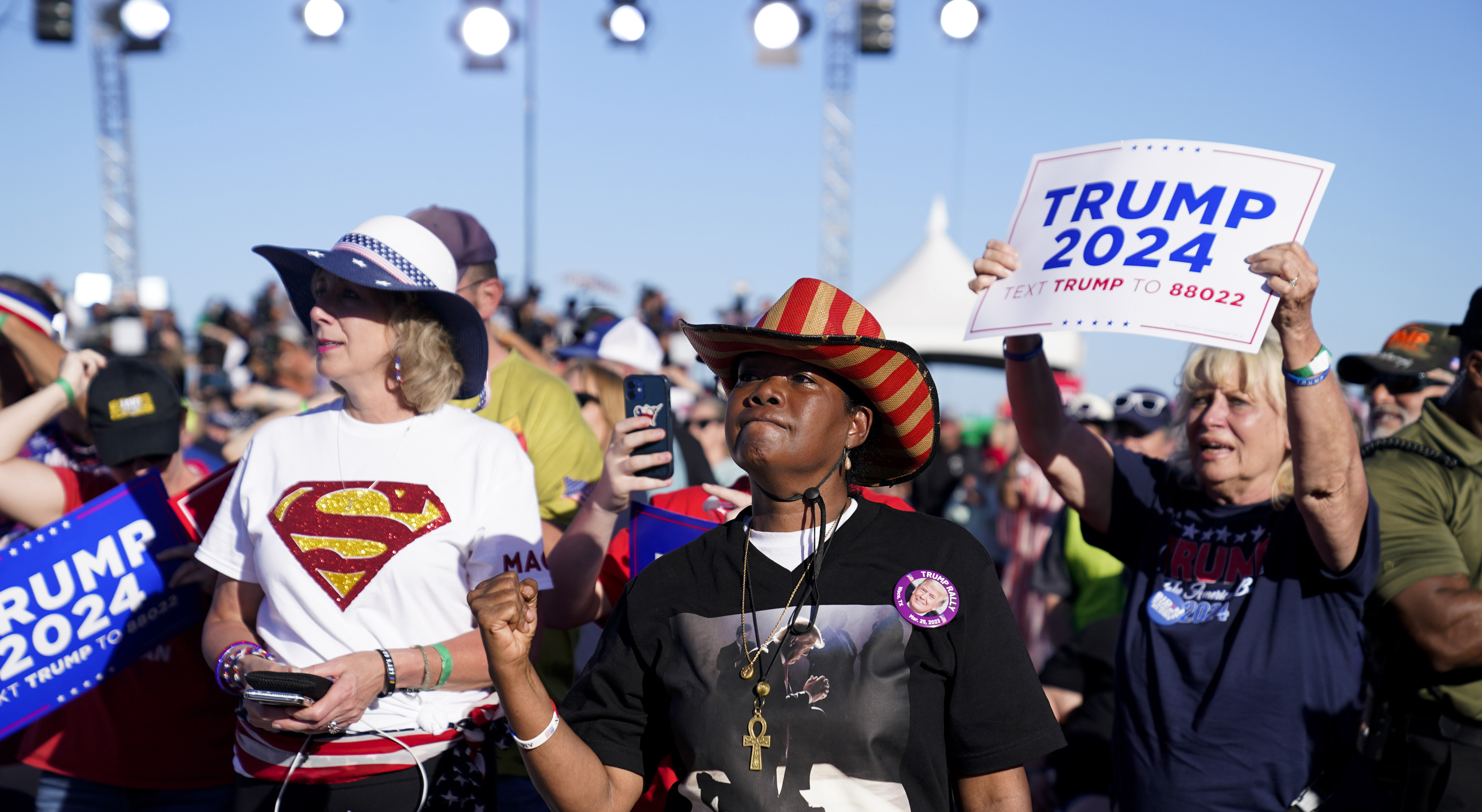 Supporters of former President Donald Trump react as he speaks at a campaign rally at Waco Regional Airport, in Waco, Texas.