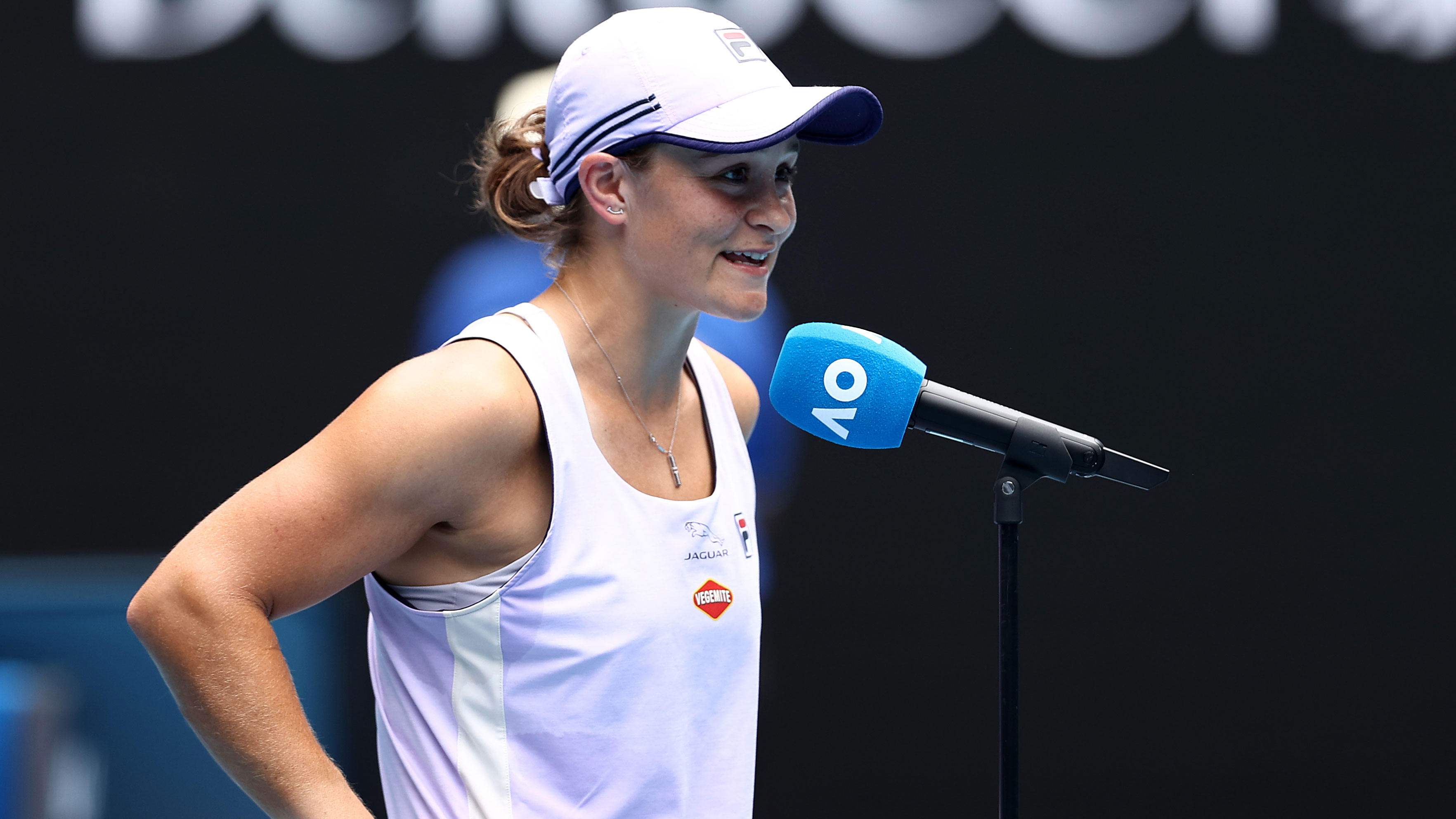 Ash Barty has a laugh with the Rod Laver Arena crowd.
