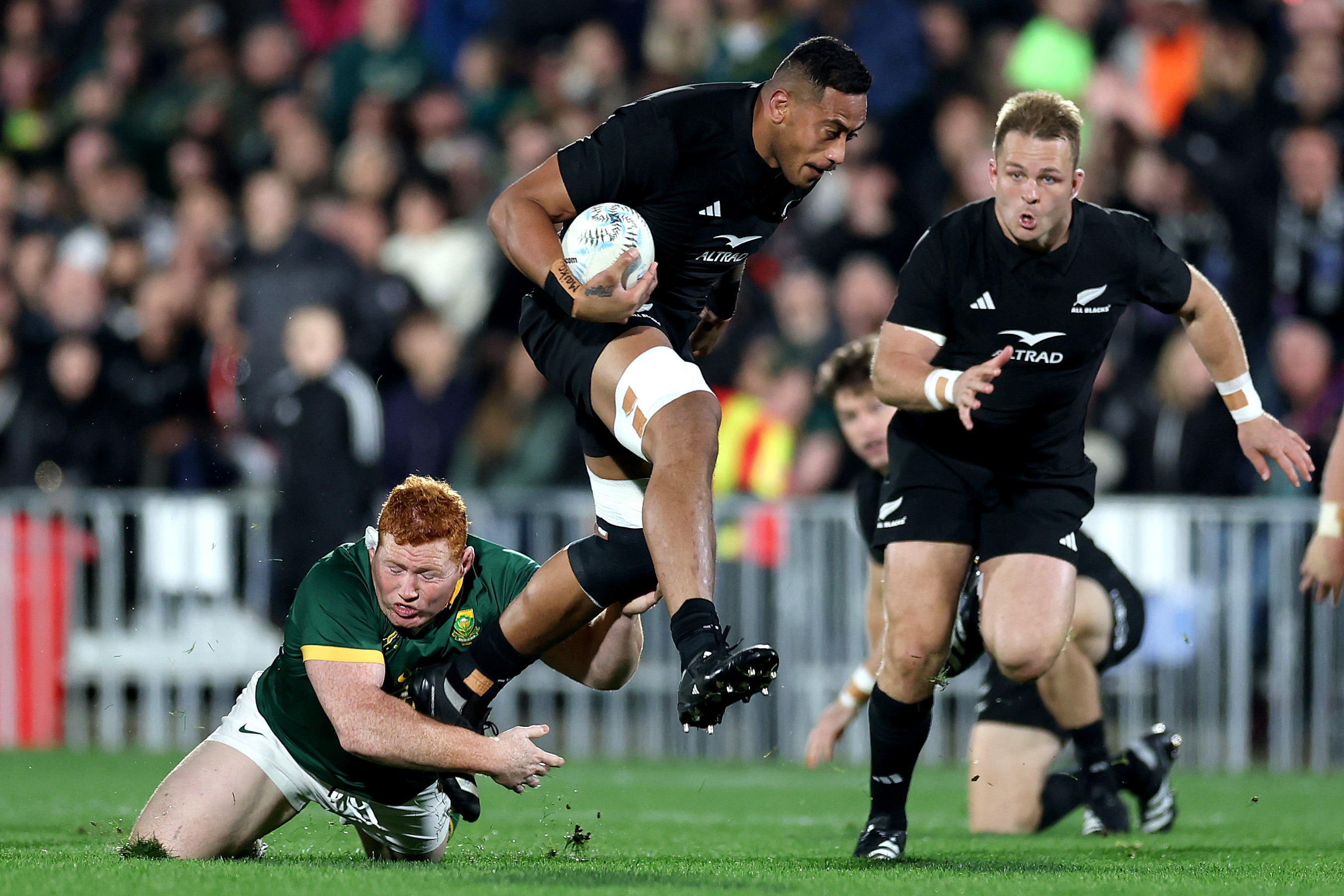 Shannon Frizell of New Zealand is tackled during The Rugby Championship match.