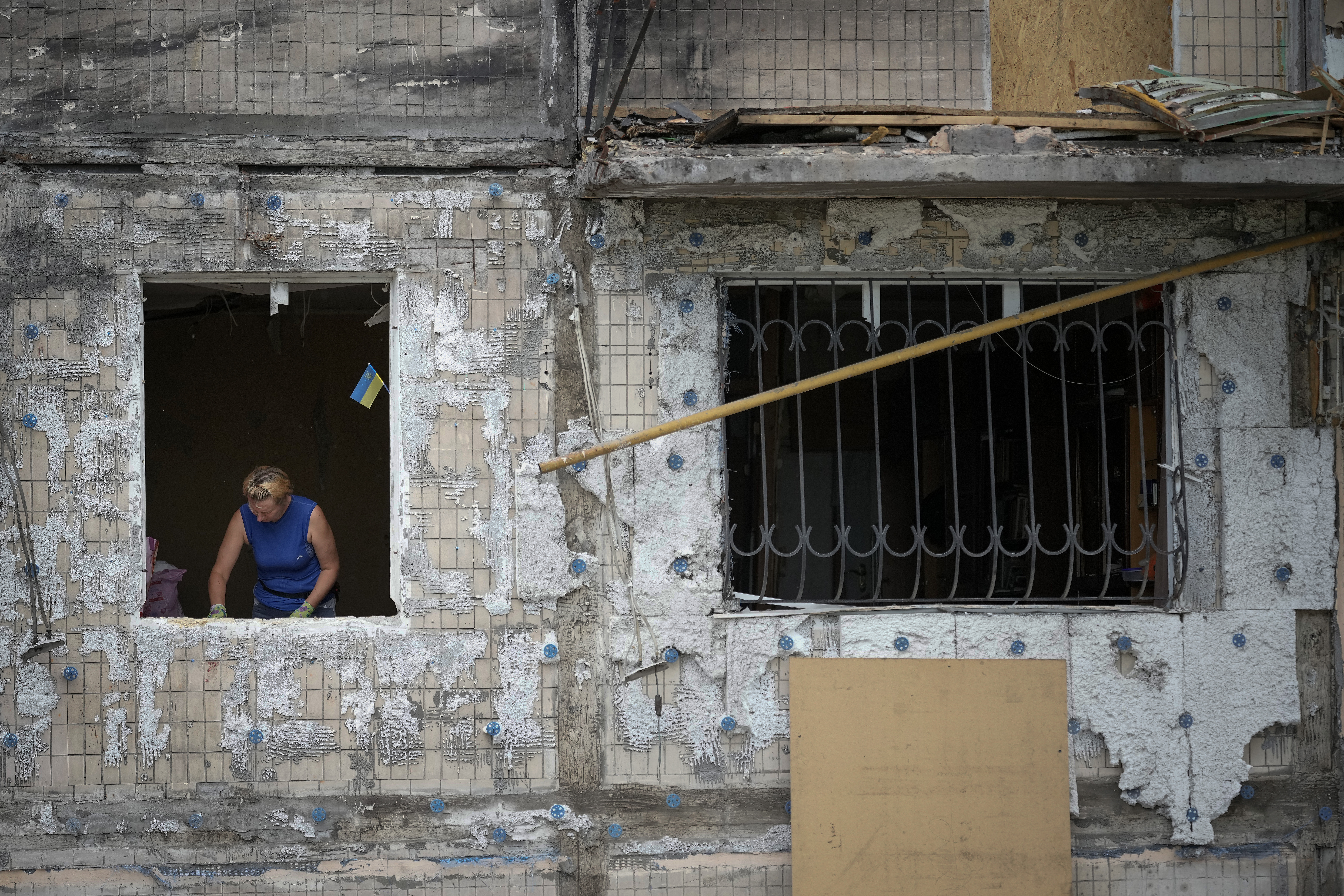 KYIV, UKRAINE - JUNE 08: AS woman removes personal belongin from a Kyiv apartment block the was hit by a Russian missile in March on June 08, 2022 in Kyiv, Ukraine.