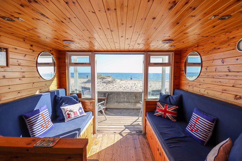 Charming beach hut in Dorset, England, on offer for $791k comes without a toilet or shower.