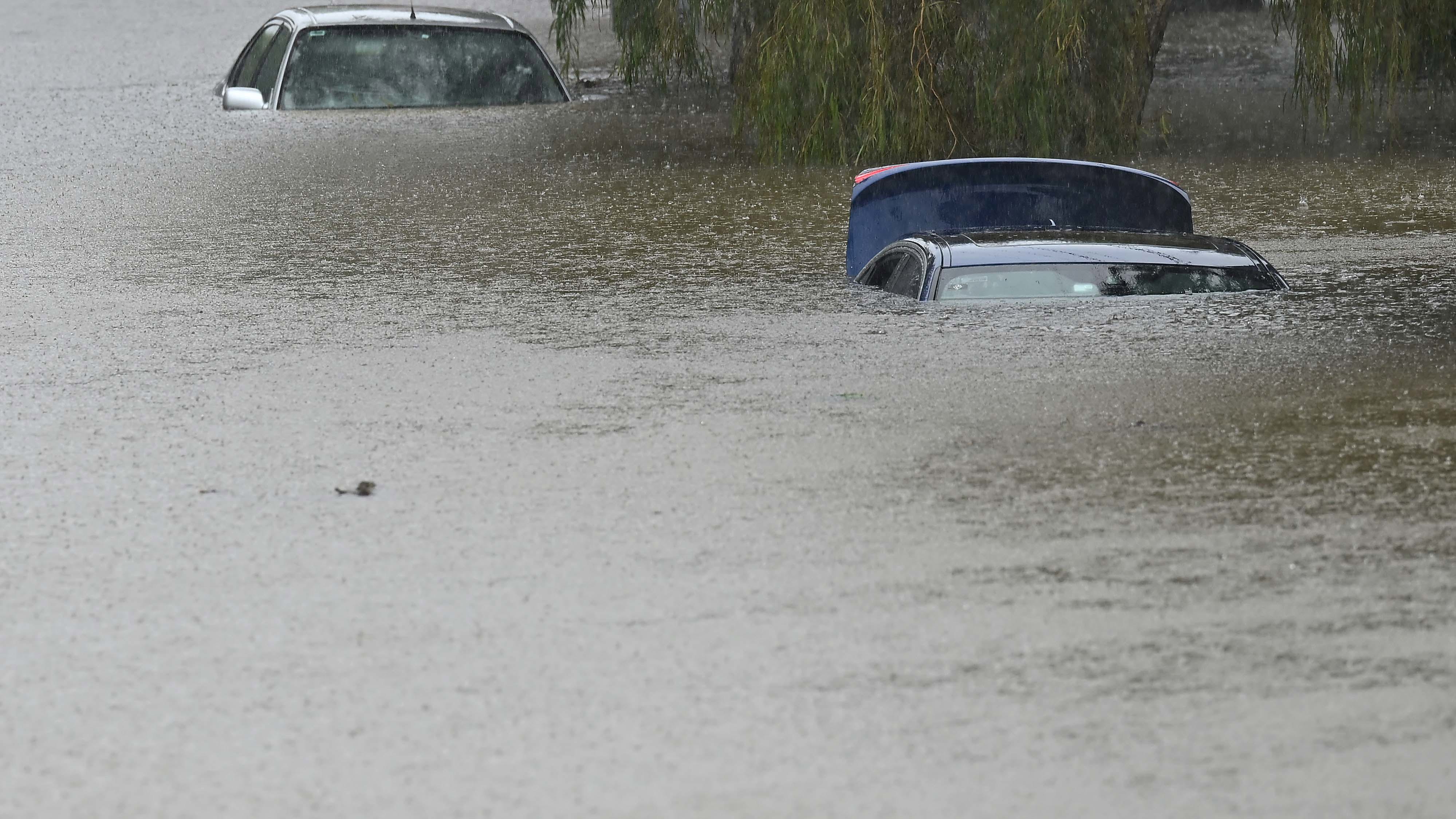 Flooded cars at Edmondstone Street in Newmarket in Brisbane.