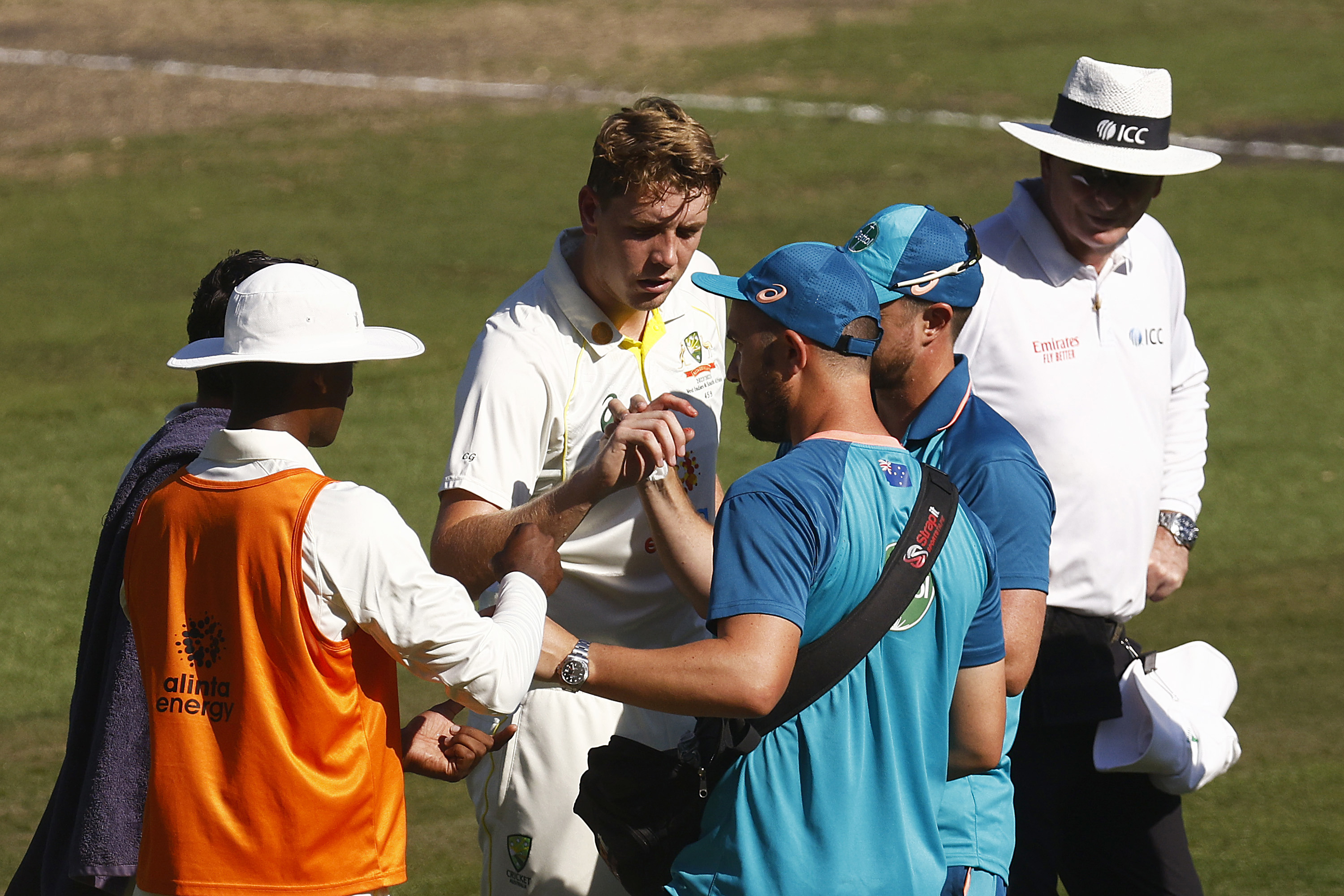 Cameron Green of Australia receives treatment for a cut finger on his right hand. (Photo by Daniel Pockett - CA/Cricket Australia via Getty Images)