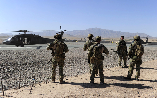 Australian Special Operations Task Group Soldiers move towards waiting UH-60 Blackhawk helicopters, in Afghanistan.
