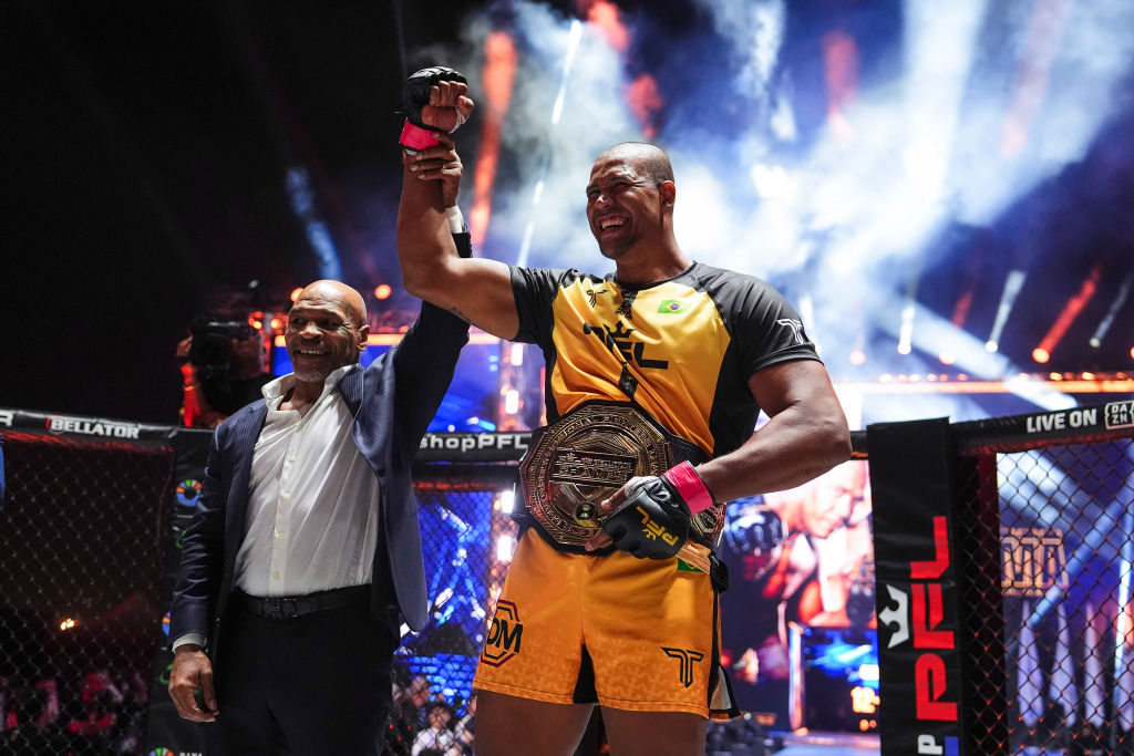 Renan Ferreira celebrates with Mike Tyson after defeating Ryan Bader.