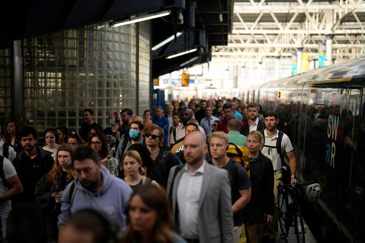 Passengers disembark from one of the few trains to arrive this morning at Waterloo railway station in London, Tuesday, June 21, 2022.  