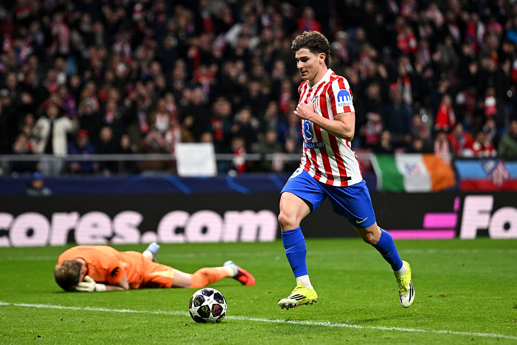Julian Alvarez of Atletico Madrid scores his team's third goal as Antonin Kinsky lies dejected.