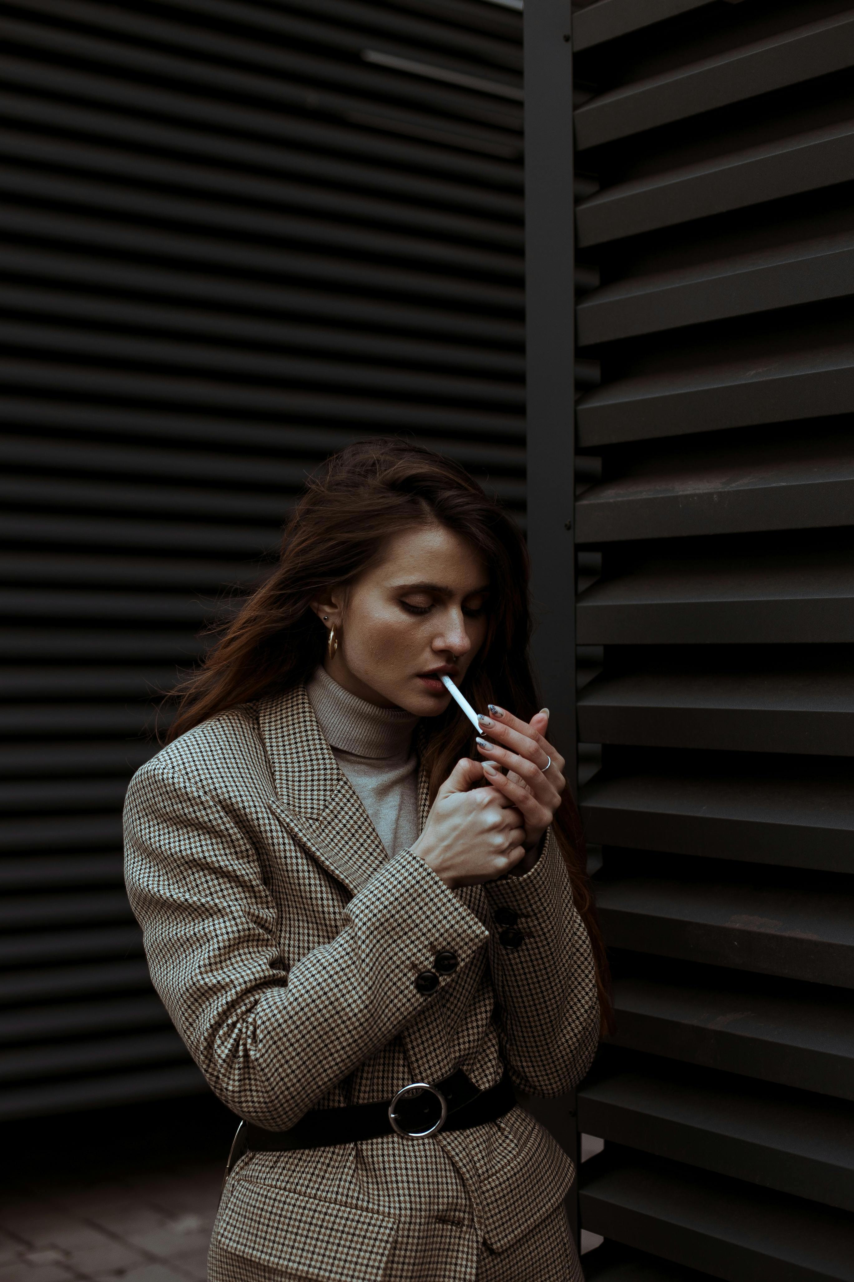 Stock photo of a woman smoking a cigarette.