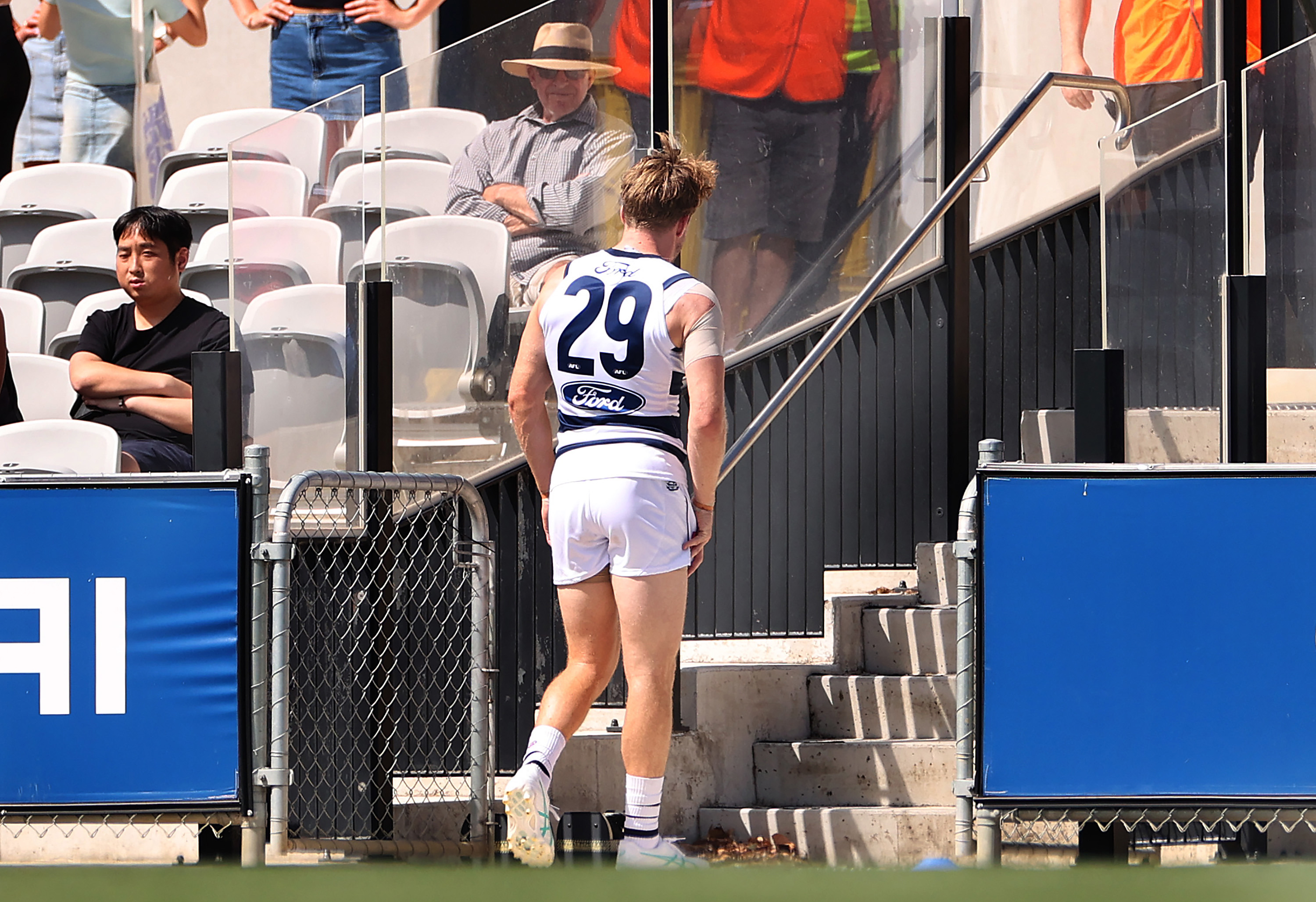 Cam Guthrie leaves the field after sustaining an injury during an AFL practice match between the Carlton Blues and Geelong Cats.
