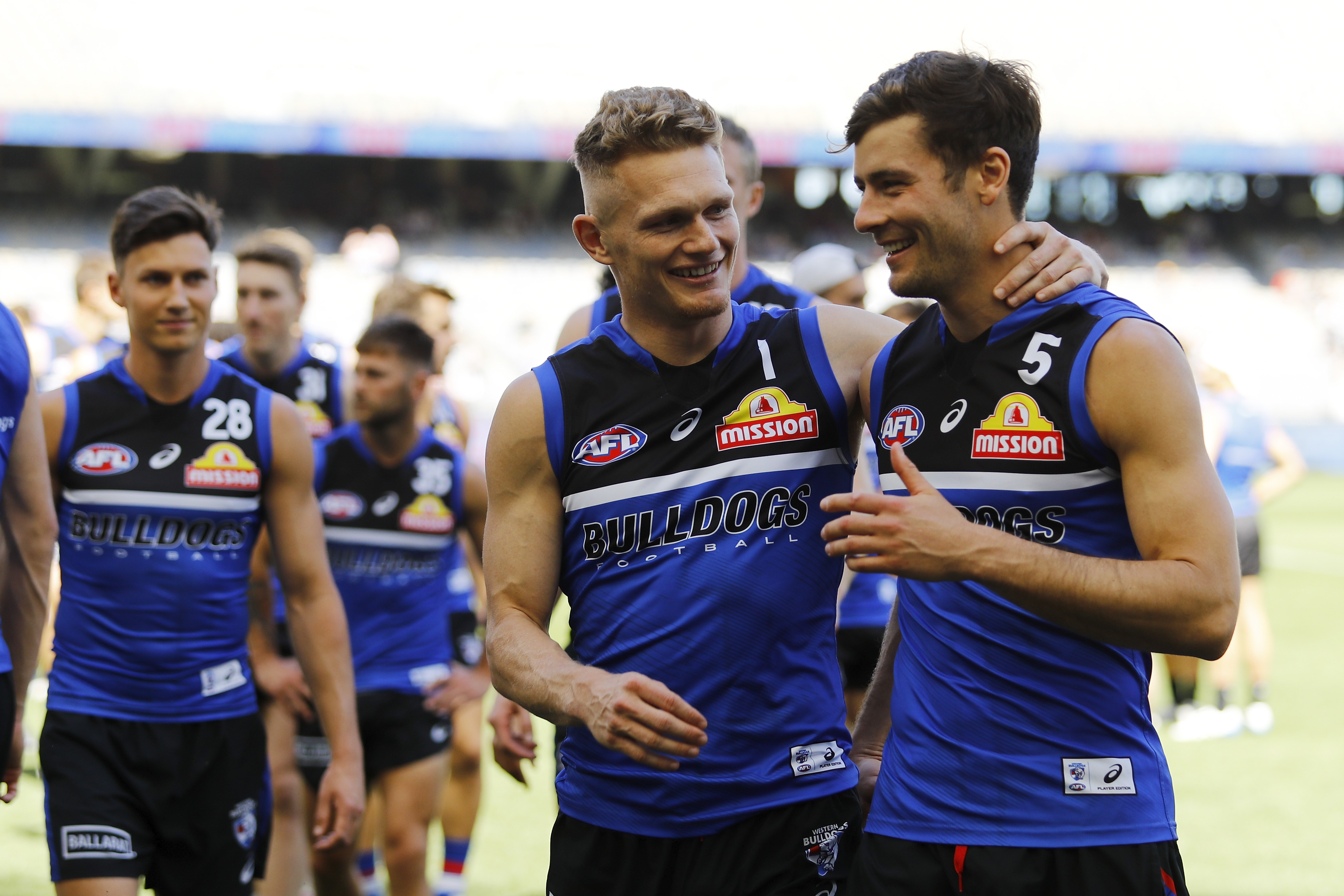 Adam Treloar and Josh Dunkley.