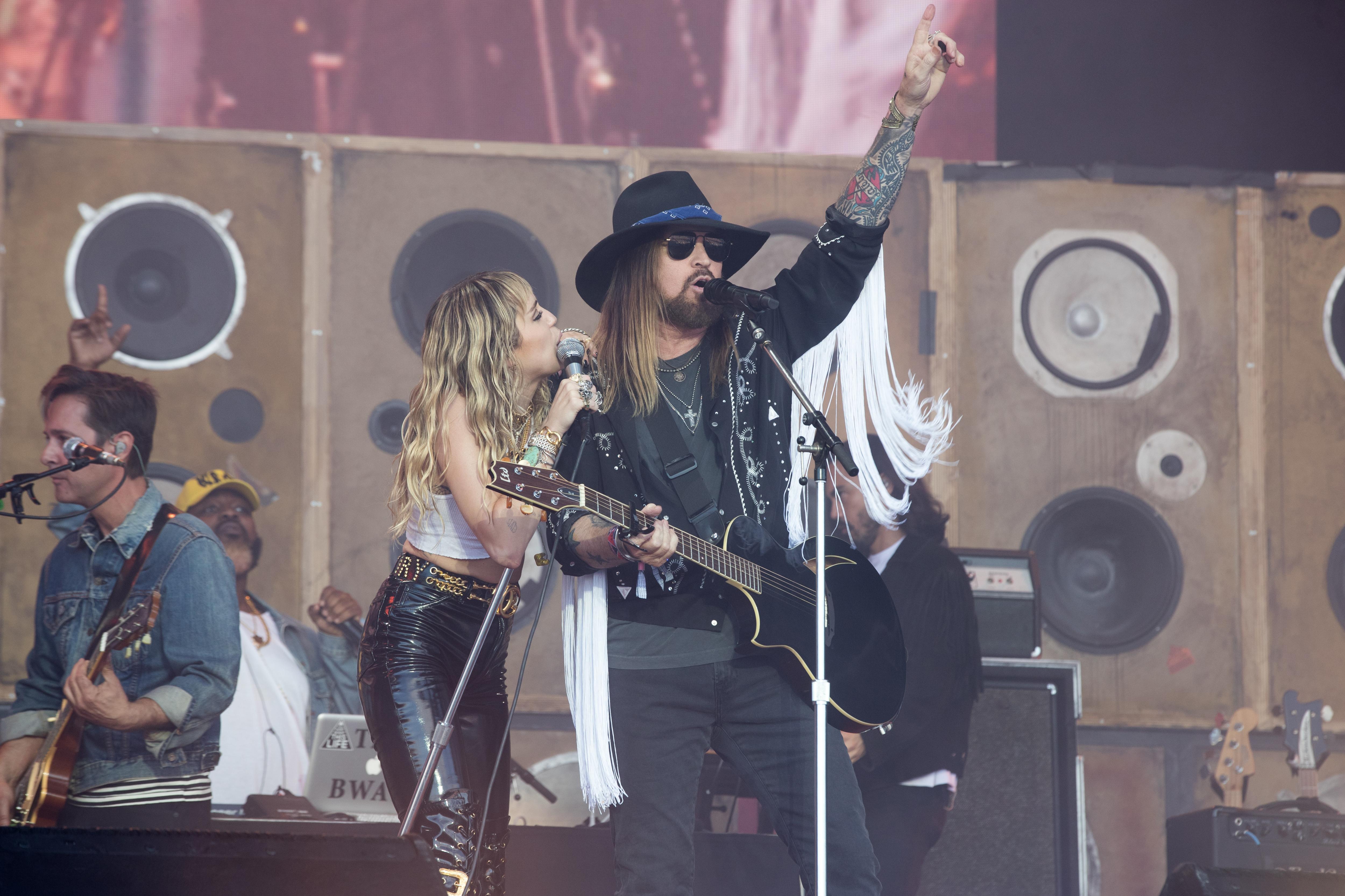 GLASTONBURY, ENGLAND - JUNE 30: Miley Ray Cyrus is joined by her father Billy Ray Cyrus as she performs live on the Pyramid stage during the 2019 Glastonbury Festival at Worthy Farm, Pilton on June 30, 2019 in Glastonbury, England. The festival, founded in 1970, has grown into one of the largest outdoor green field festivals in the world. (Photo by Matt Cardy/Getty Images)