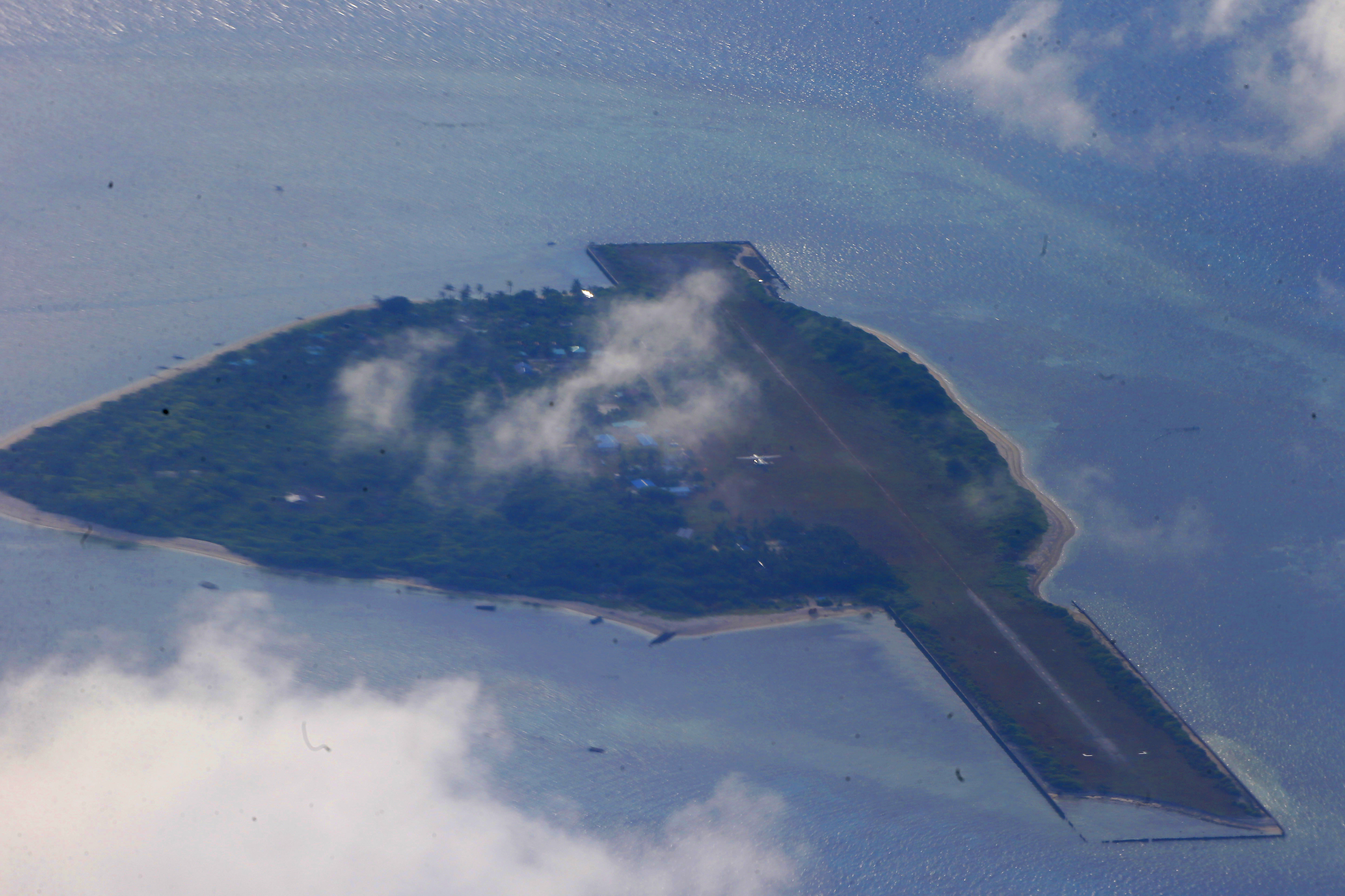 This photo taken from a C-130 transport plane shows Thitu Island off the South China Sea, April 21, 2017. 