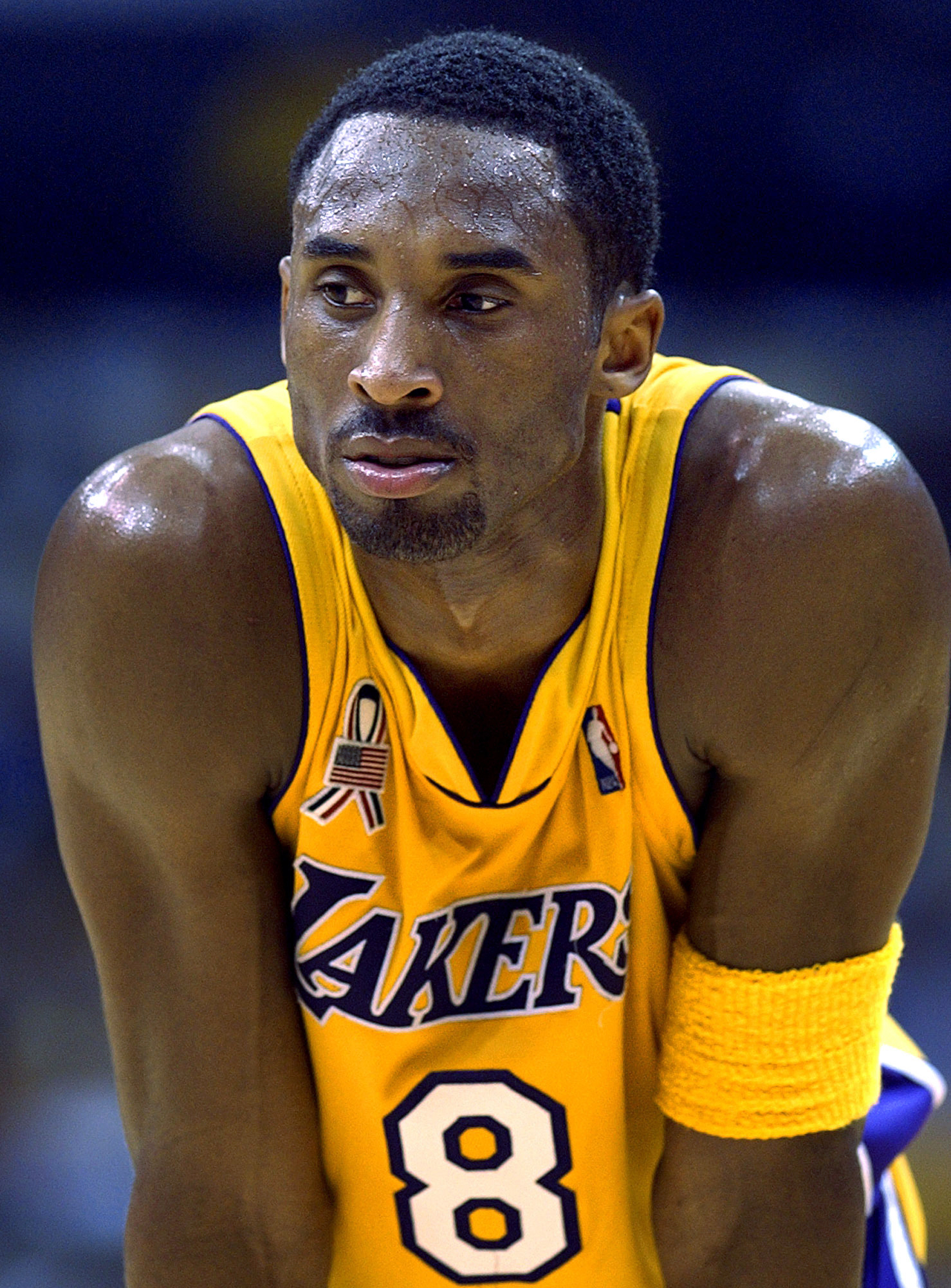 In this 2002 file photo Los Angeles Lakers' Kobe Bryant waits between plays during the opener of their best-of-five first-round Western Conference playoff series against the Portland Trail Blazers in Los Angeles
