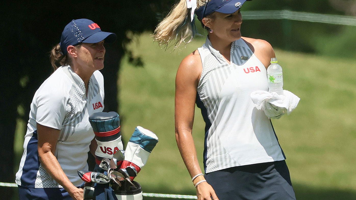Lexi Thompson of Team United States and stand-in caddie Donna Wilkins at the Tokyo Olympics.