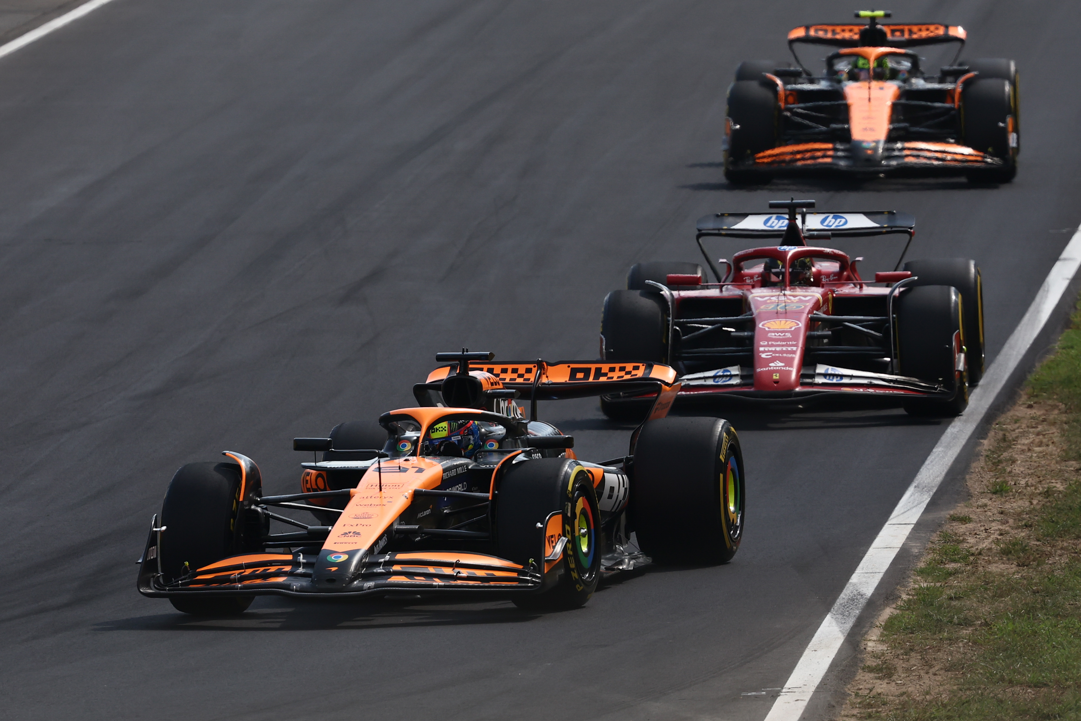 Oscar Piastri of McLaren, Charles Leclerc of Ferrari and Lando Norris of McLaren during the Formula 1 Italian Grand Prix at Autodromo Nazionale di Monza in Monza, Italy on September 1, 2024. (Photo by Jakub Porzycki/NurPhoto)