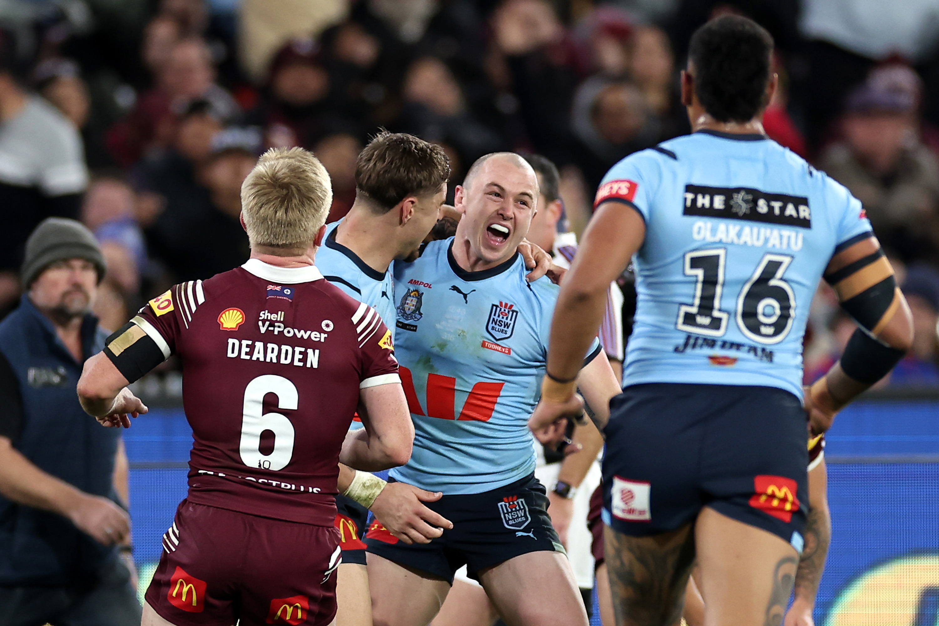 Dylan Edwards of the Blues celebrates with team mates after scoring a try in his debut Origin match.