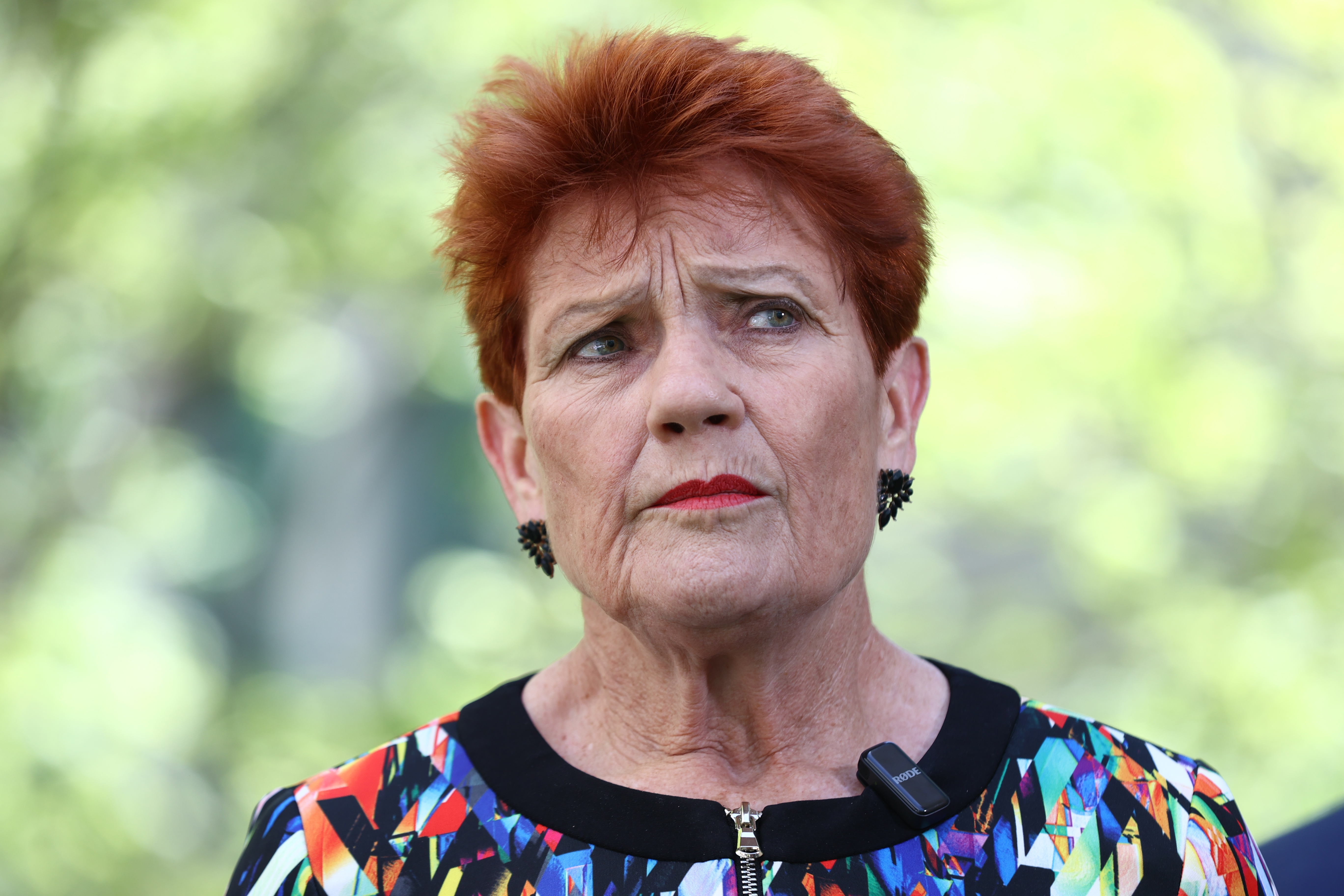 One Nation Senator Pauline Hanson speaks to the media after bing expelled from the Senate for 7 days after she wore a burqa in the chamber on November 25, 2025. Photo: Dominic Lorrimer