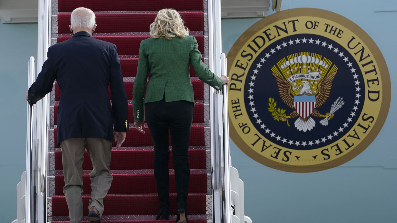 President Joe Biden and first lady Jill Biden walk up the steps of Air Force One at Andrews Air Force Base, Md., Friday, Feb. 26, 2021