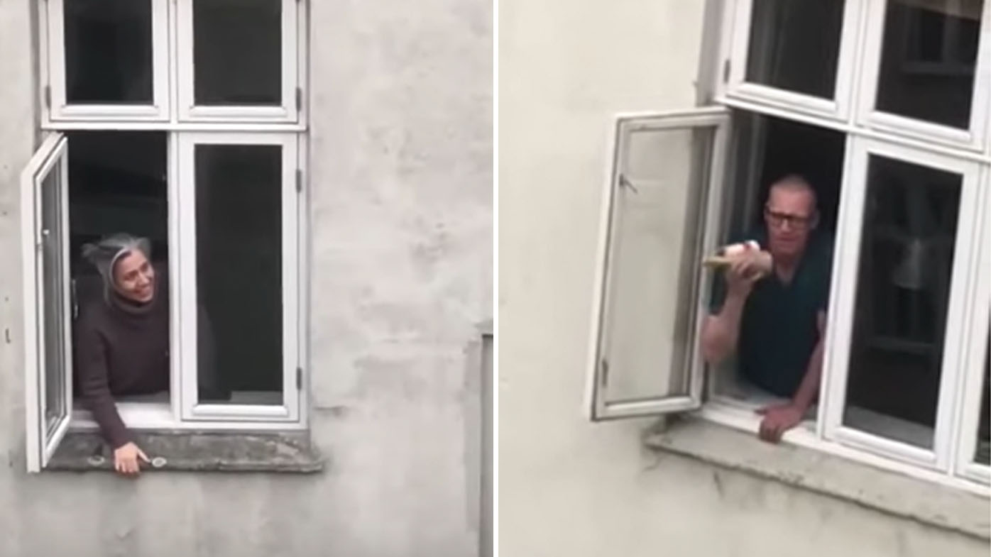 Danish residents sing 'You've got a friend in me' from windows
 