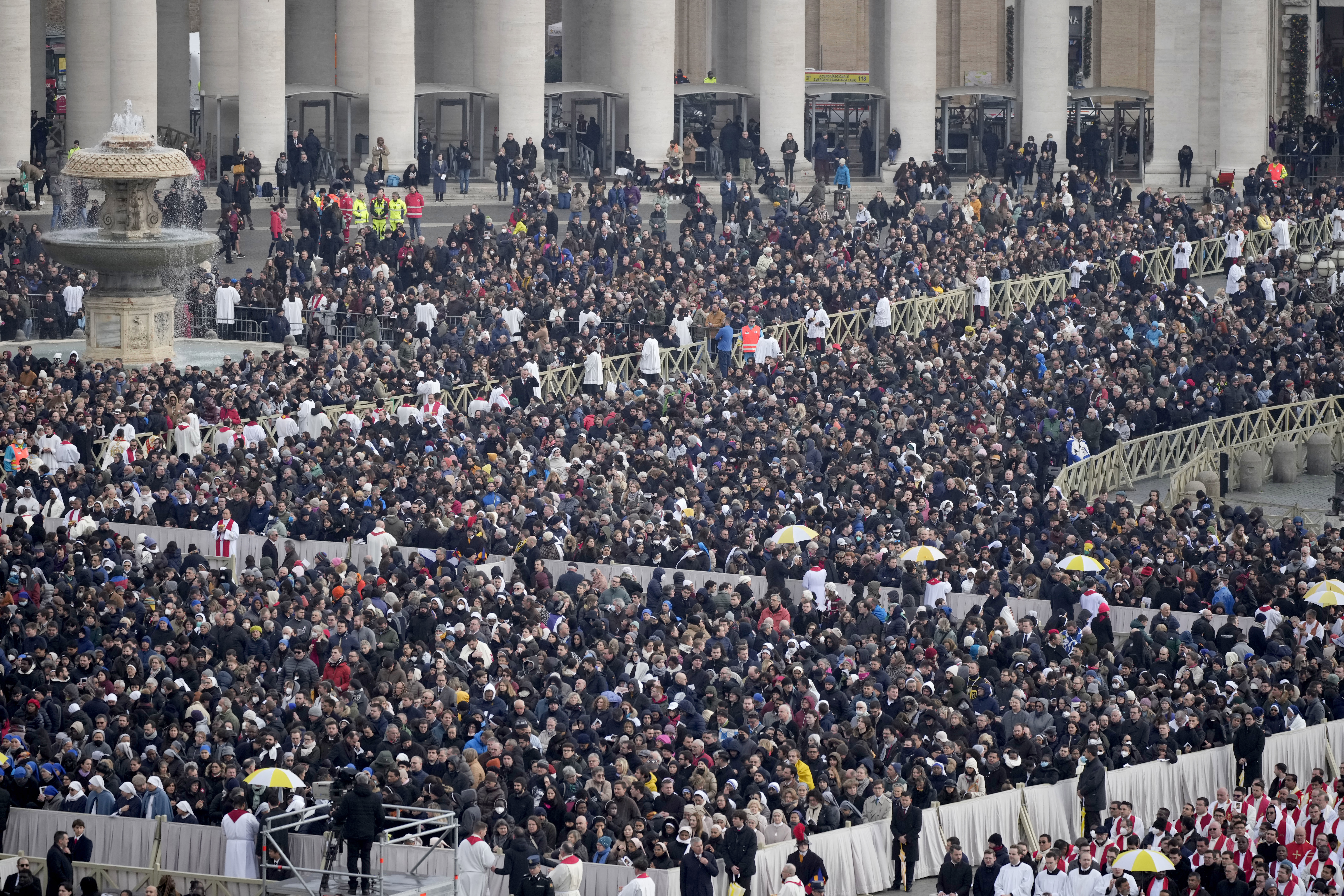 VATICAN CITY, VATICAN - JANUARY 05: Mourners attend the funeral mass for Pope Emeritus Benedict XVI at St. Peter's square on January 5, 2023 in Vatican City, Vatican. Former Pope Benedict XVI, who served as head of the Catholic Church from 19 April 2005 until his resignation on 28 February 2013, died on 31 December 2022 aged 95 at the Mater Ecclesiae Monastery in Vatican City. Over 135,000 people paid their tributes on the first two days of the late pontiff's lying in state at St. Peter's Basili